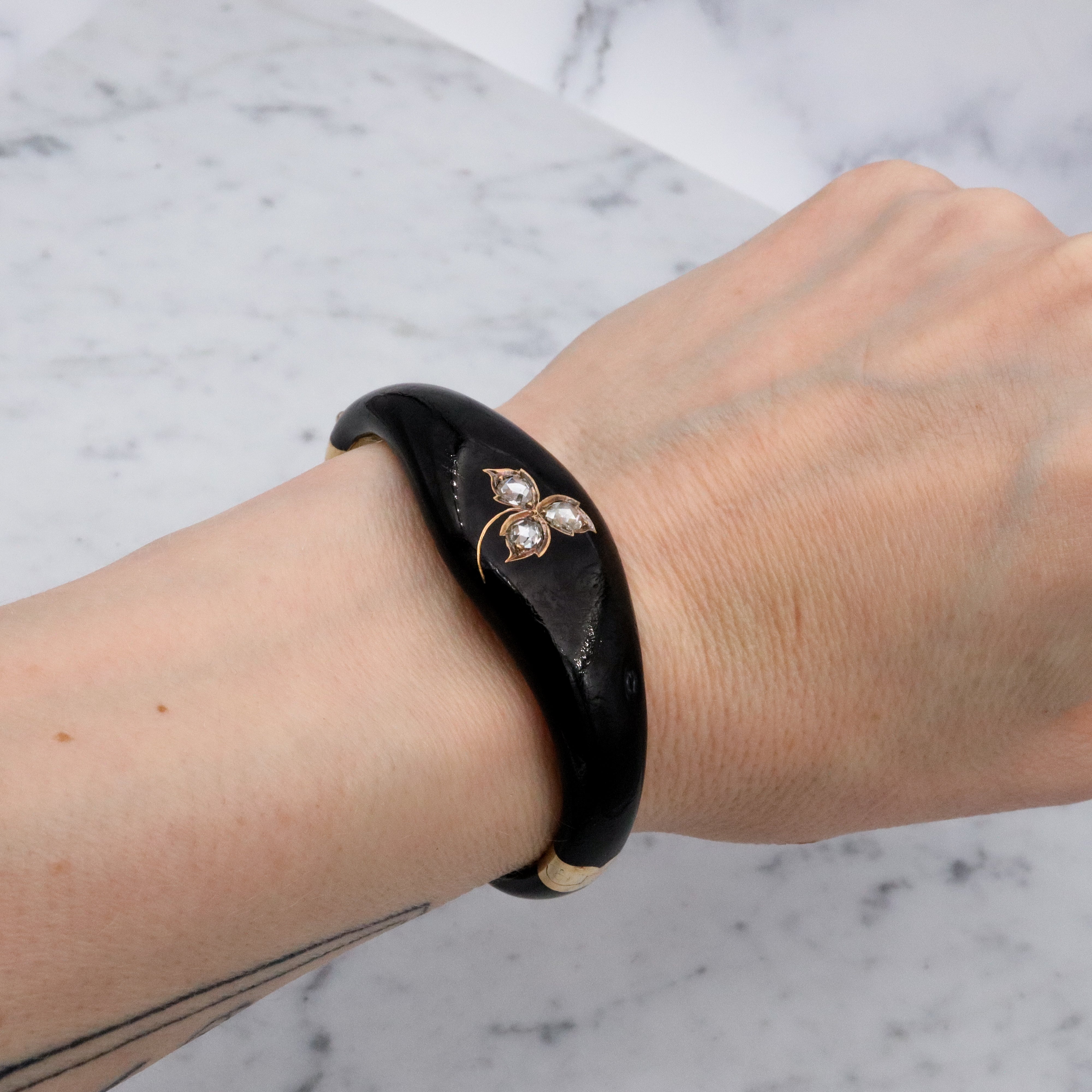 Antique Victorian 14k gold black enamel mourning bangle with rose cut diamonds