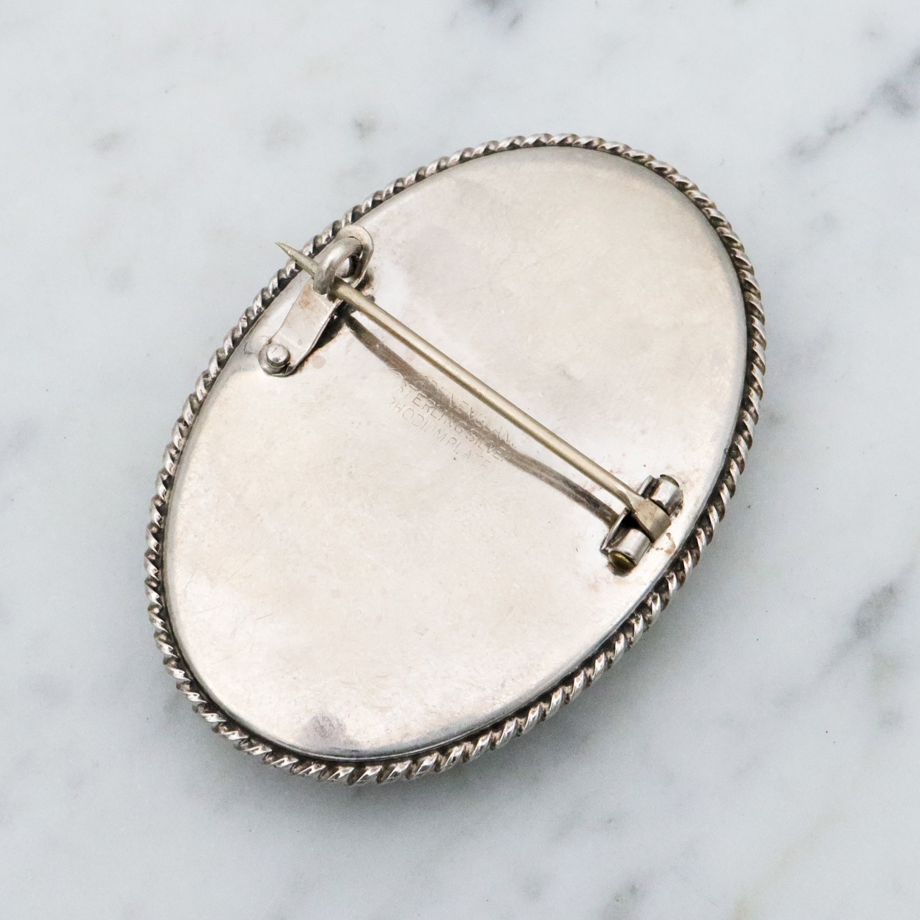 Antique sterling brooch with portrait of 