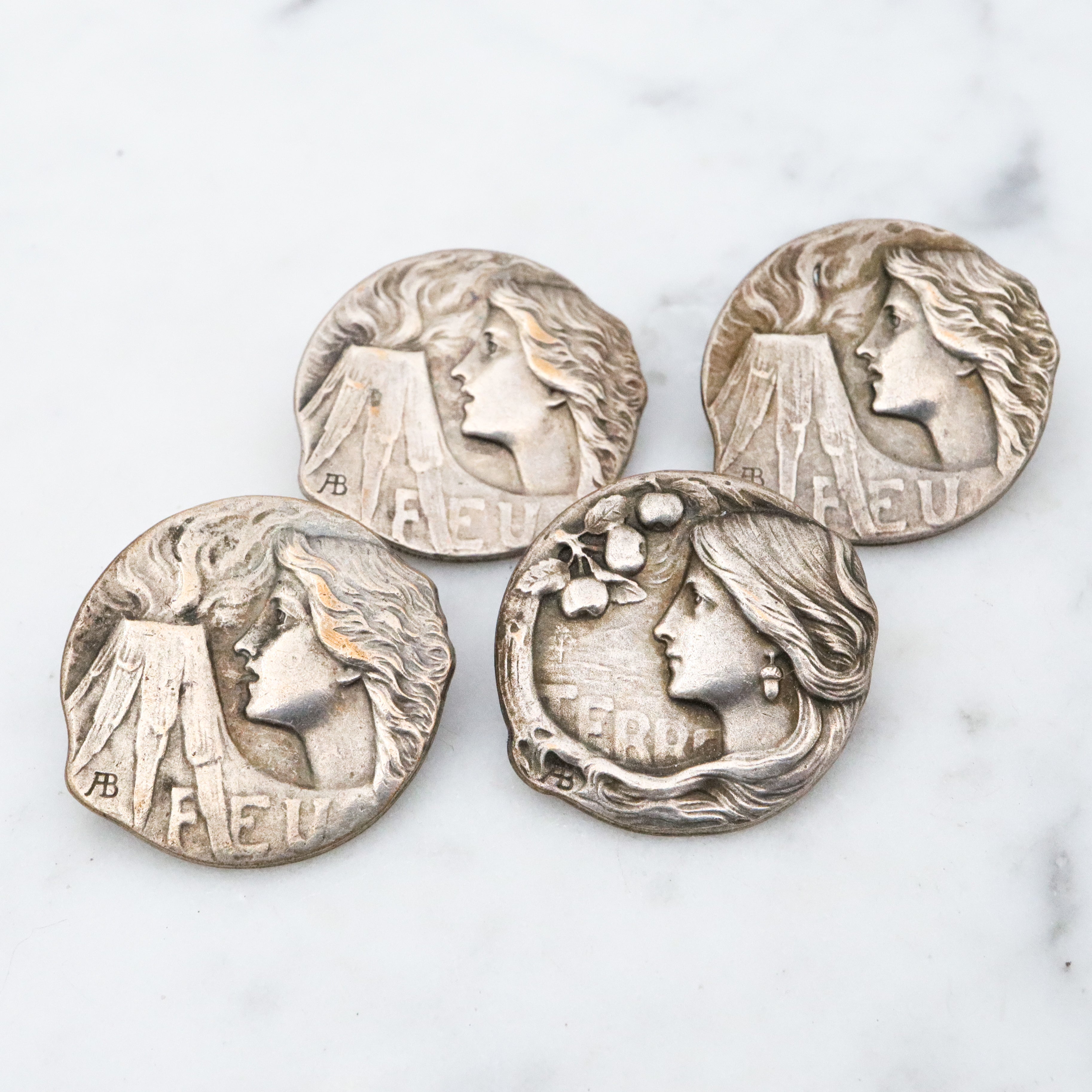 Group of 4 Antique Art Nouveau Armand Bargas Earth & Fire silver plated buttons
