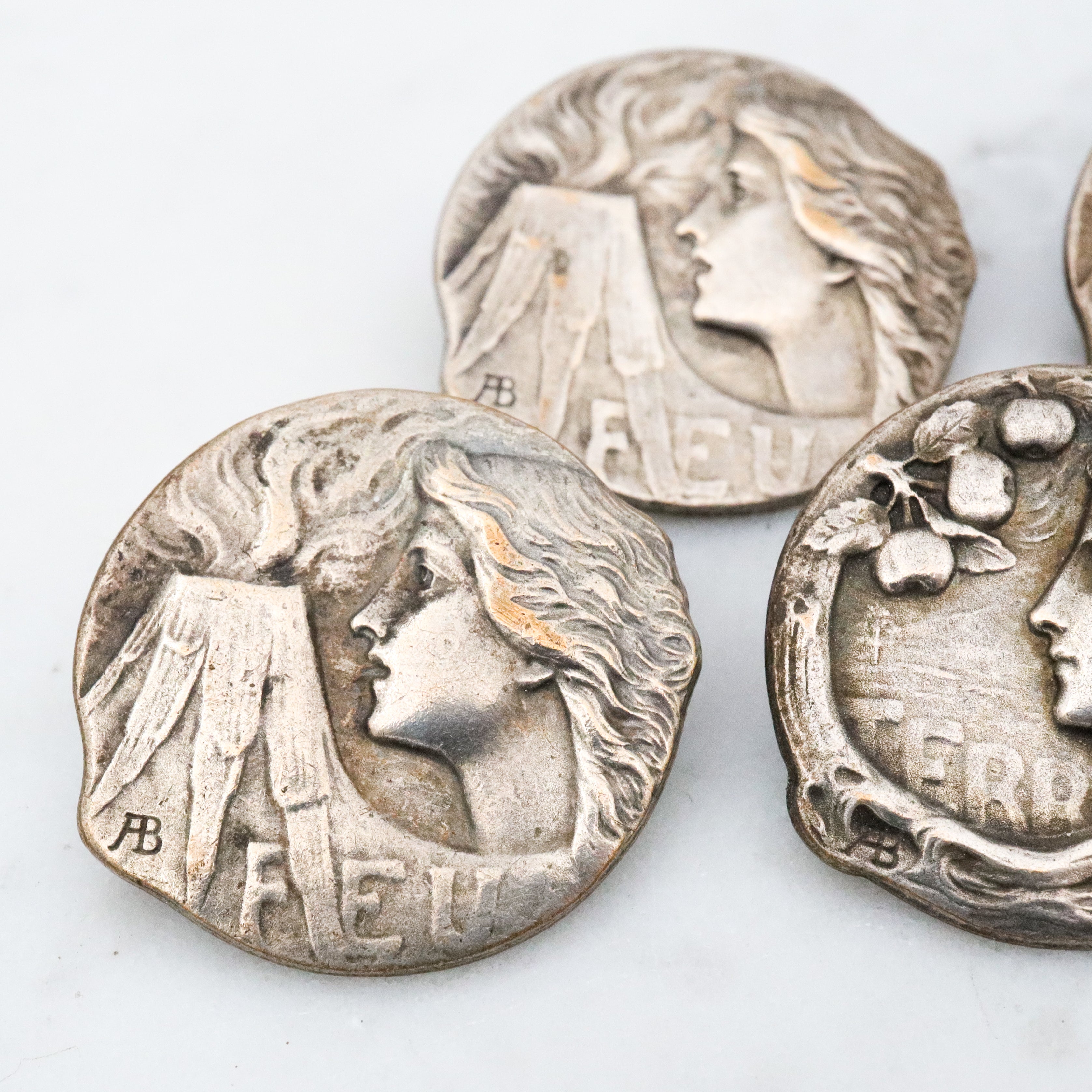 Group of 4 Antique Art Nouveau Armand Bargas Earth & Fire silver plated buttons