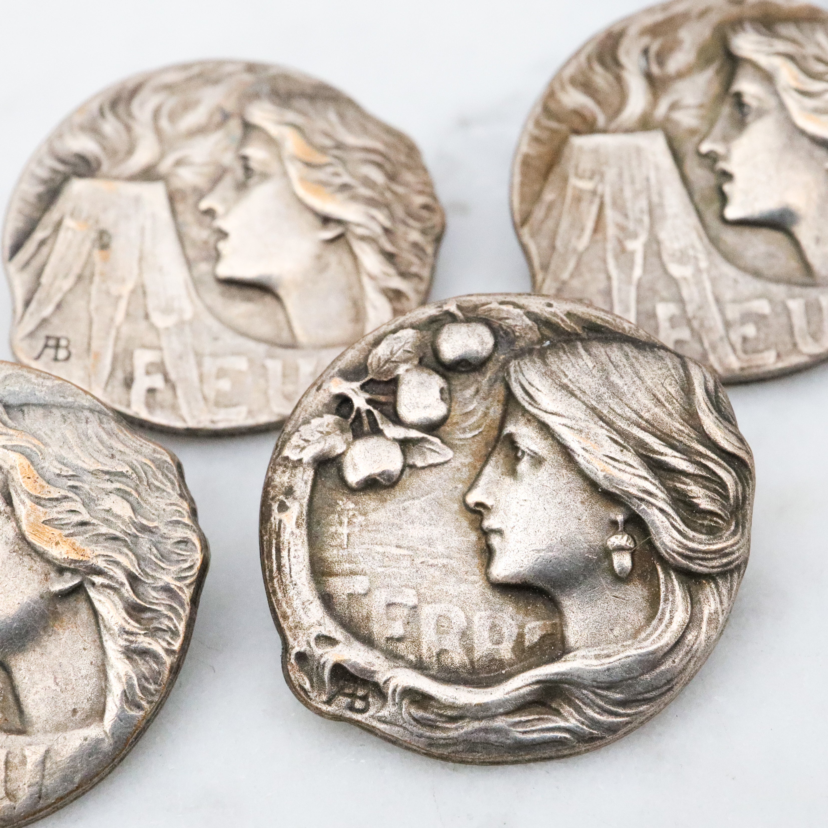 Group of 4 Antique Art Nouveau Armand Bargas Earth & Fire silver plated buttons