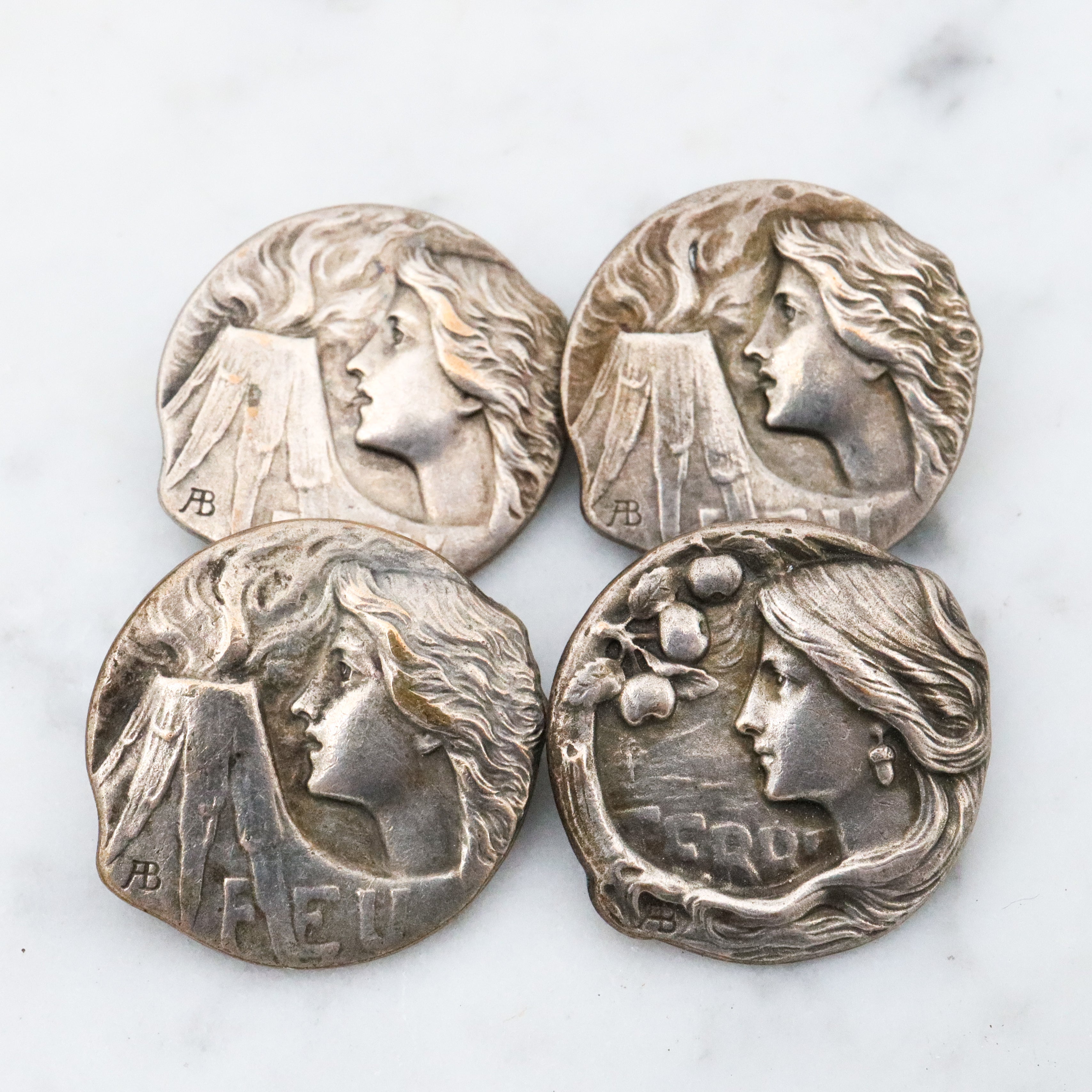 Group of 4 Antique Art Nouveau Armand Bargas Earth & Fire silver plated buttons