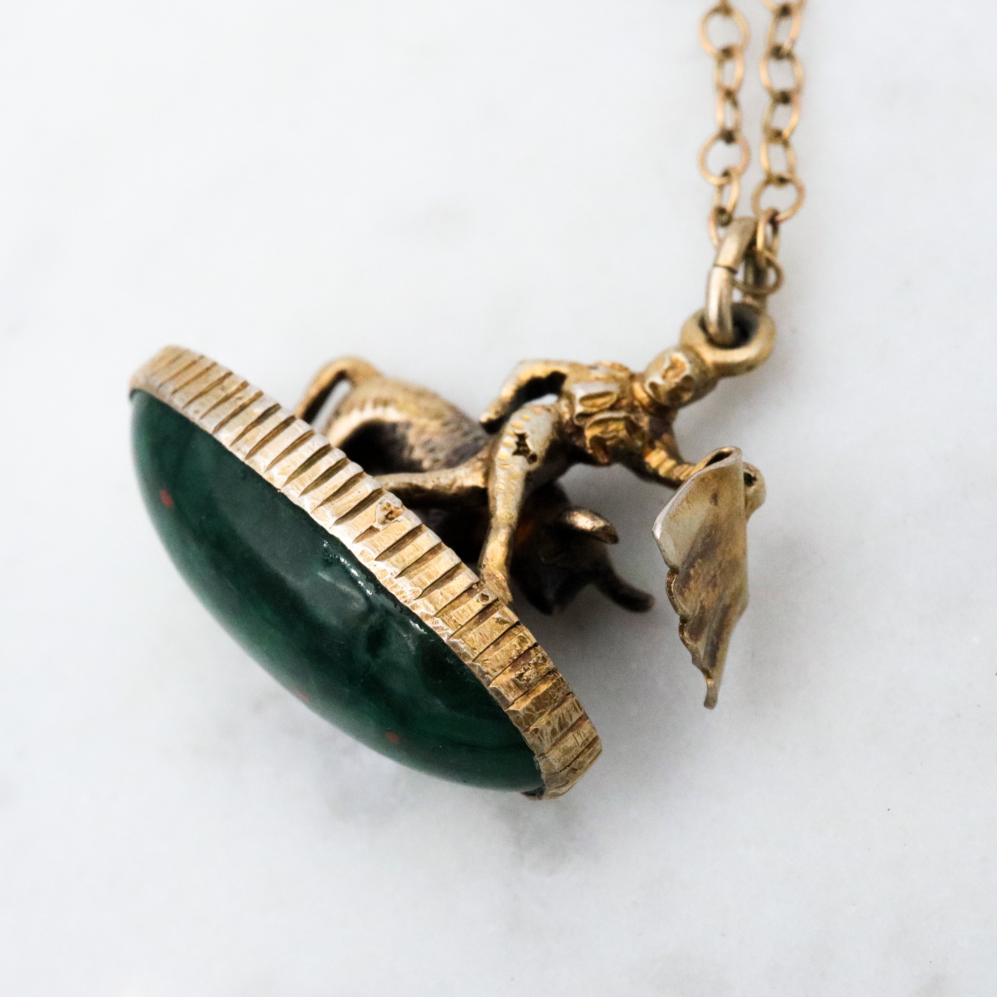 Antique gilt sterling figural matador & bull fob pendant w/faux bloodstone bottom
