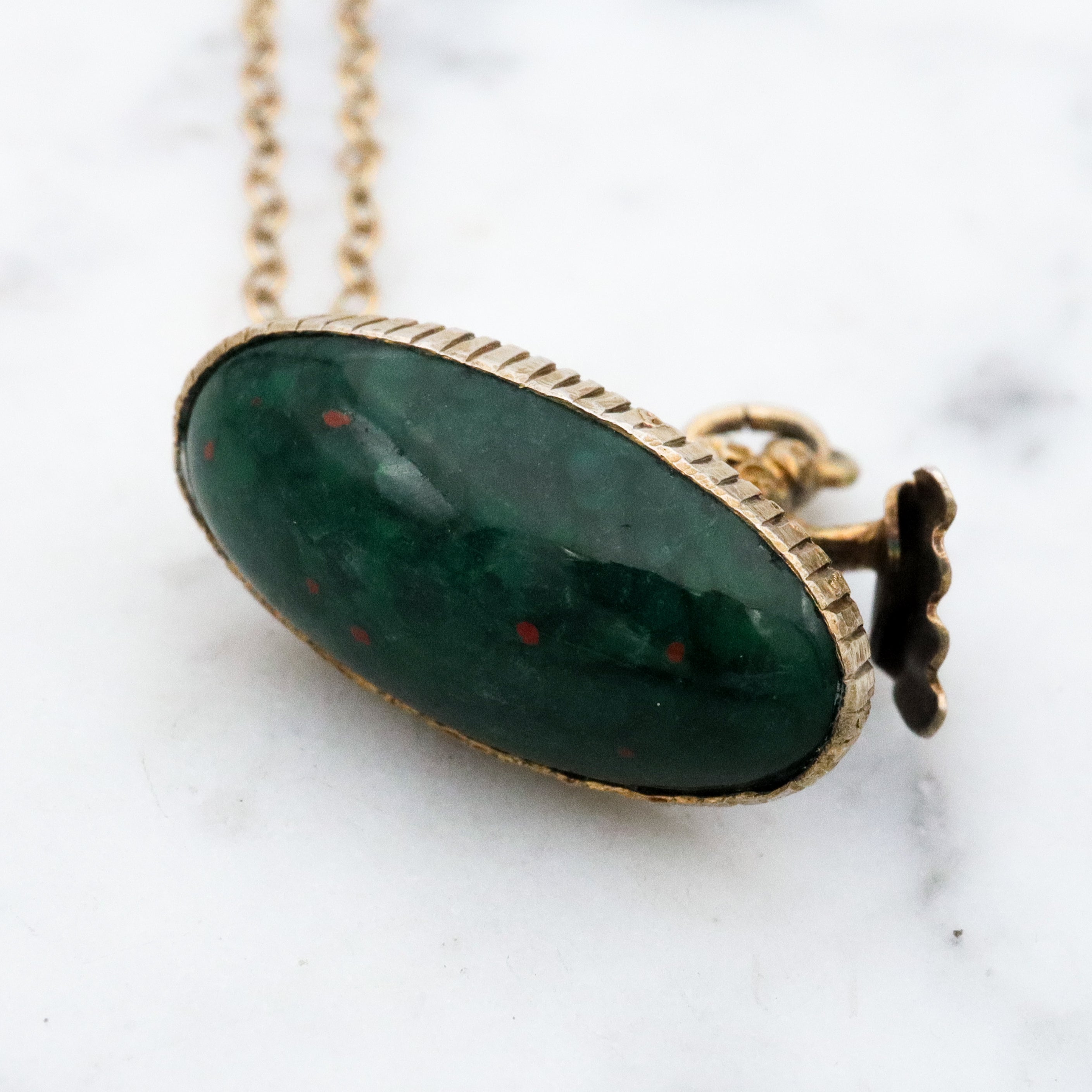 Antique gilt sterling figural matador & bull fob pendant w/faux bloodstone bottom