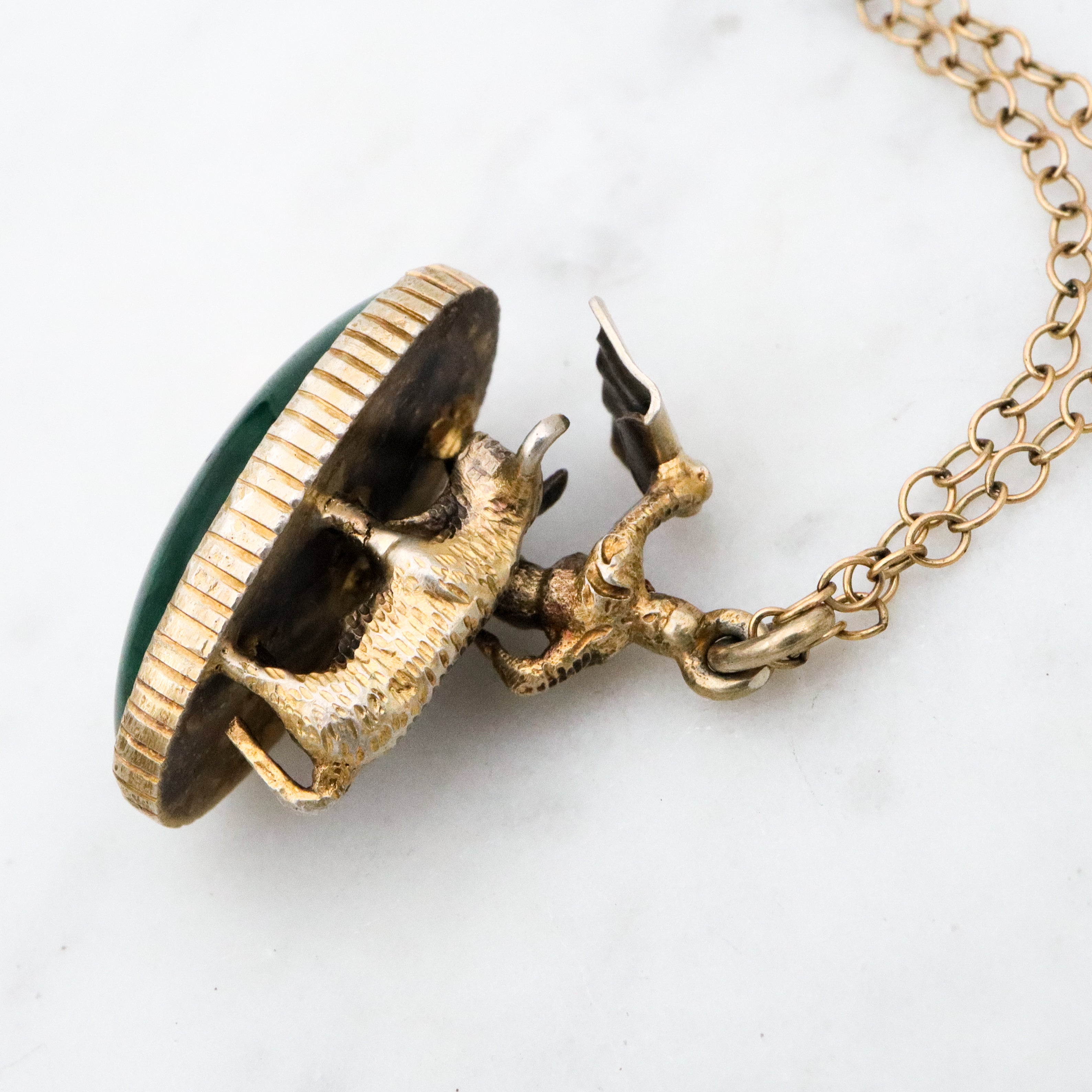 Antique gilt sterling figural matador & bull fob pendant w/faux bloodstone bottom