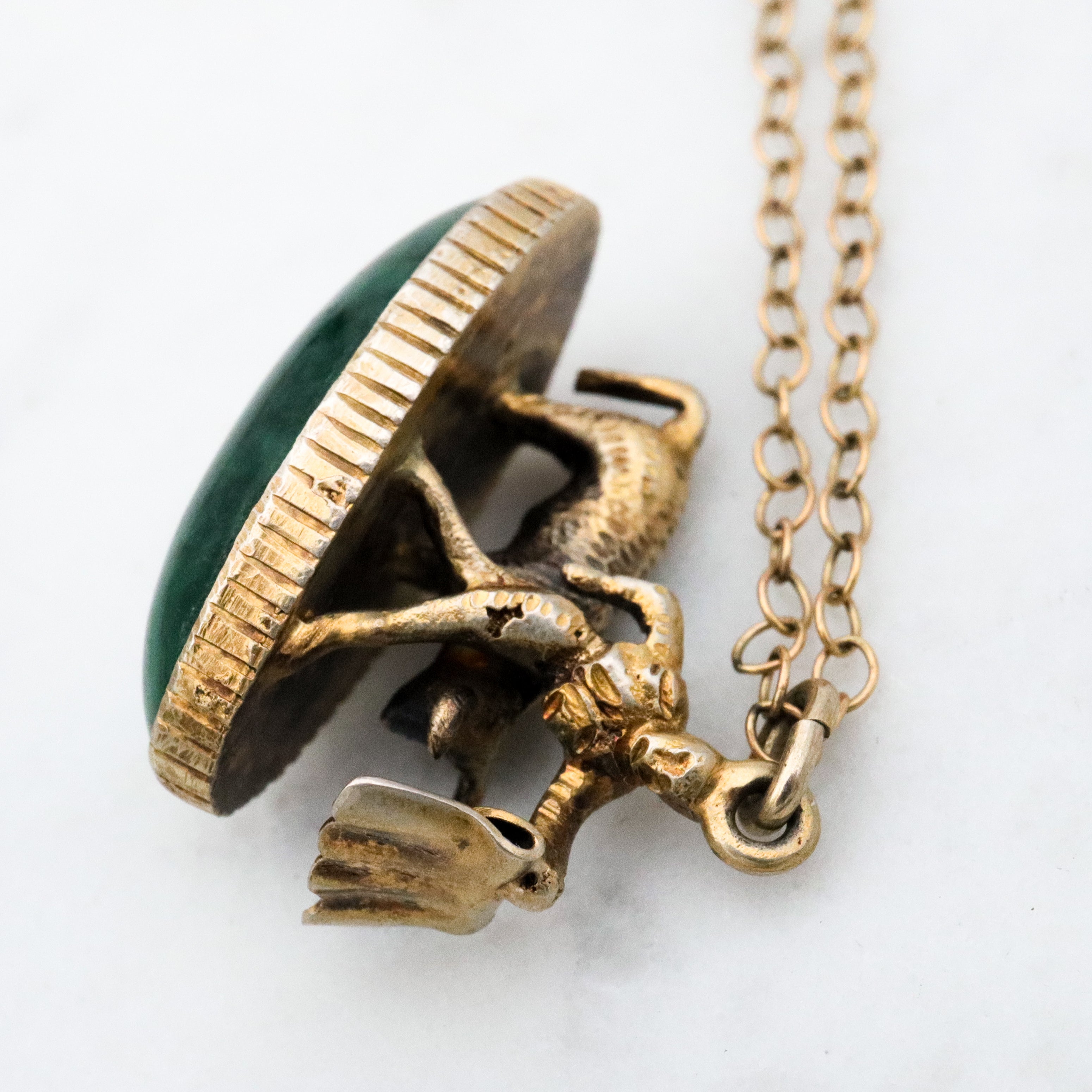 Antique gilt sterling figural matador & bull fob pendant w/faux bloodstone bottom