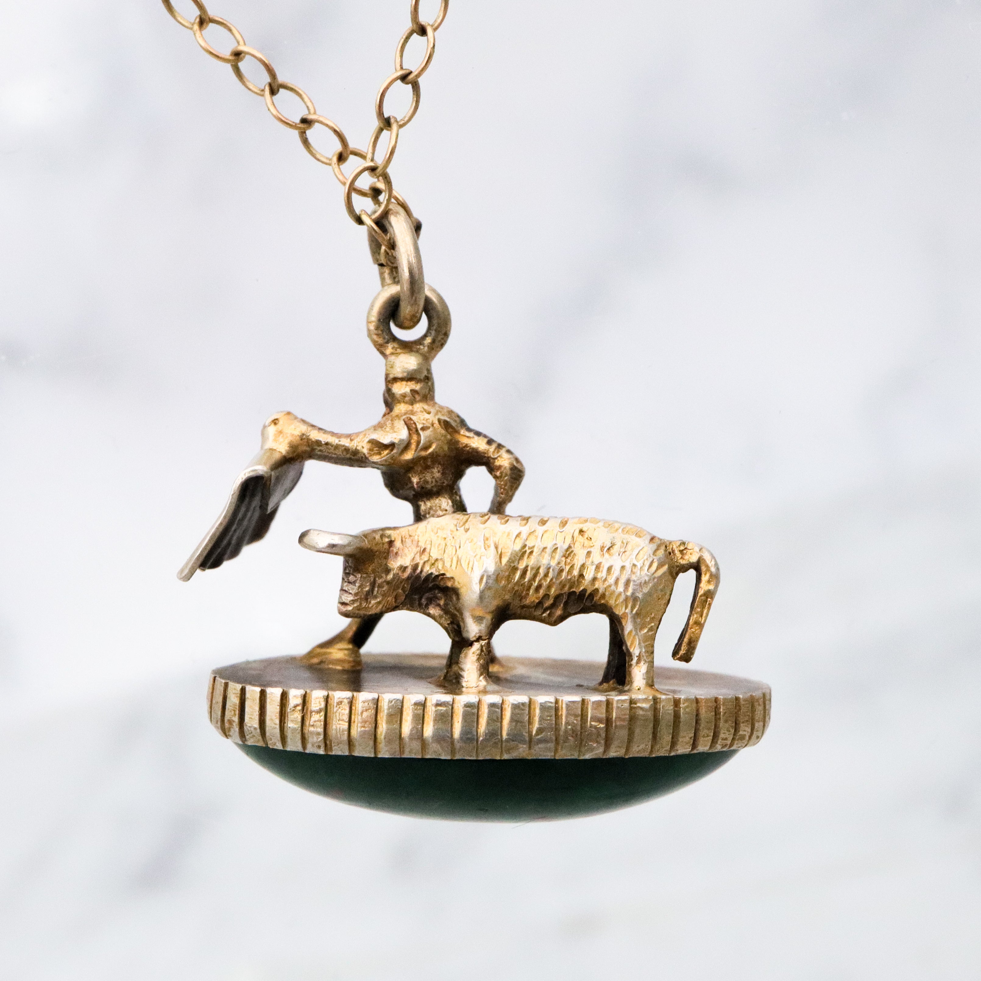 Antique gilt sterling figural matador & bull fob pendant w/faux bloodstone bottom