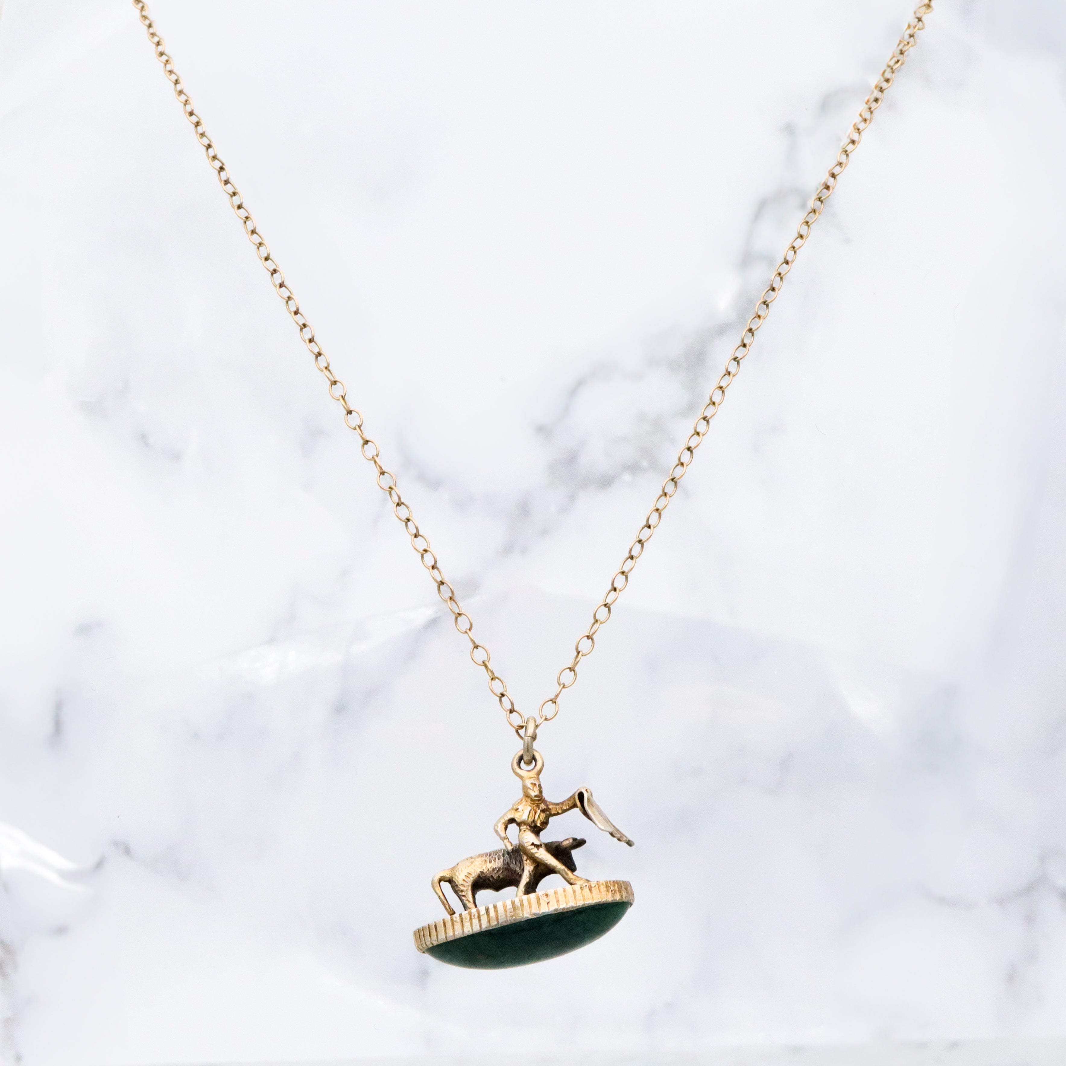 Antique gilt sterling figural matador & bull fob pendant w/faux bloodstone bottom