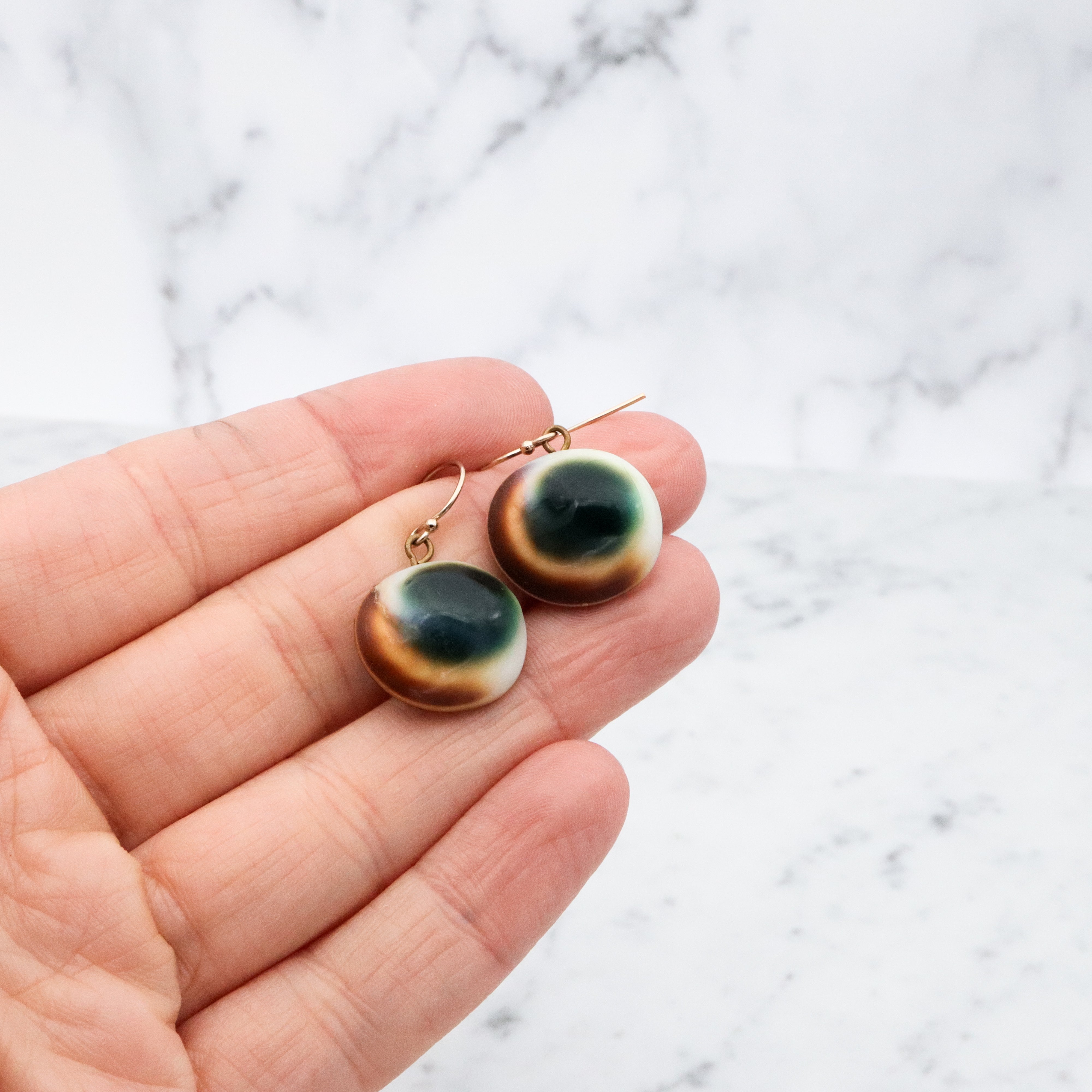 Mid Century cat's eye operculum shell drop earrings