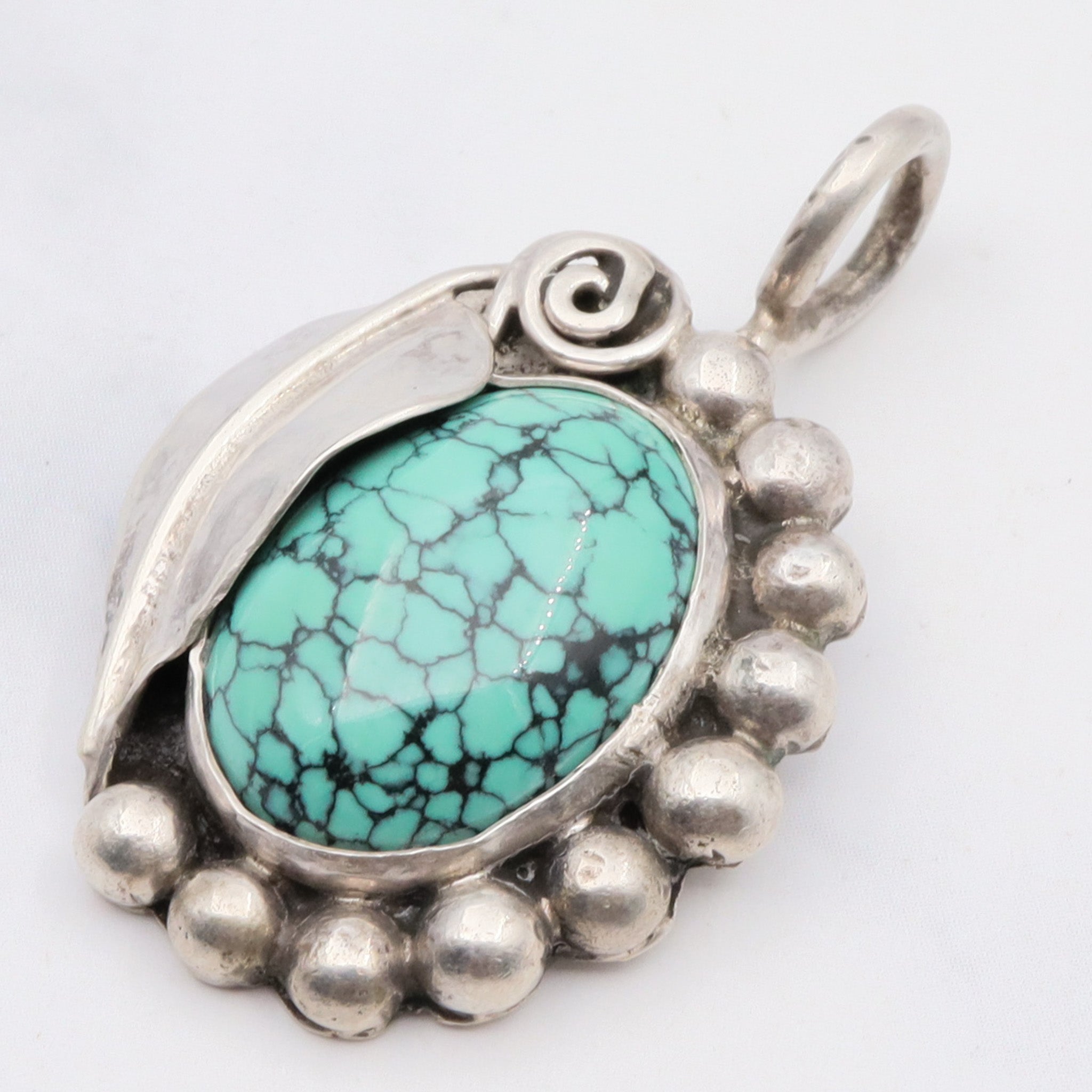 Native American sterling silver and turquoise handmade leaf pendant