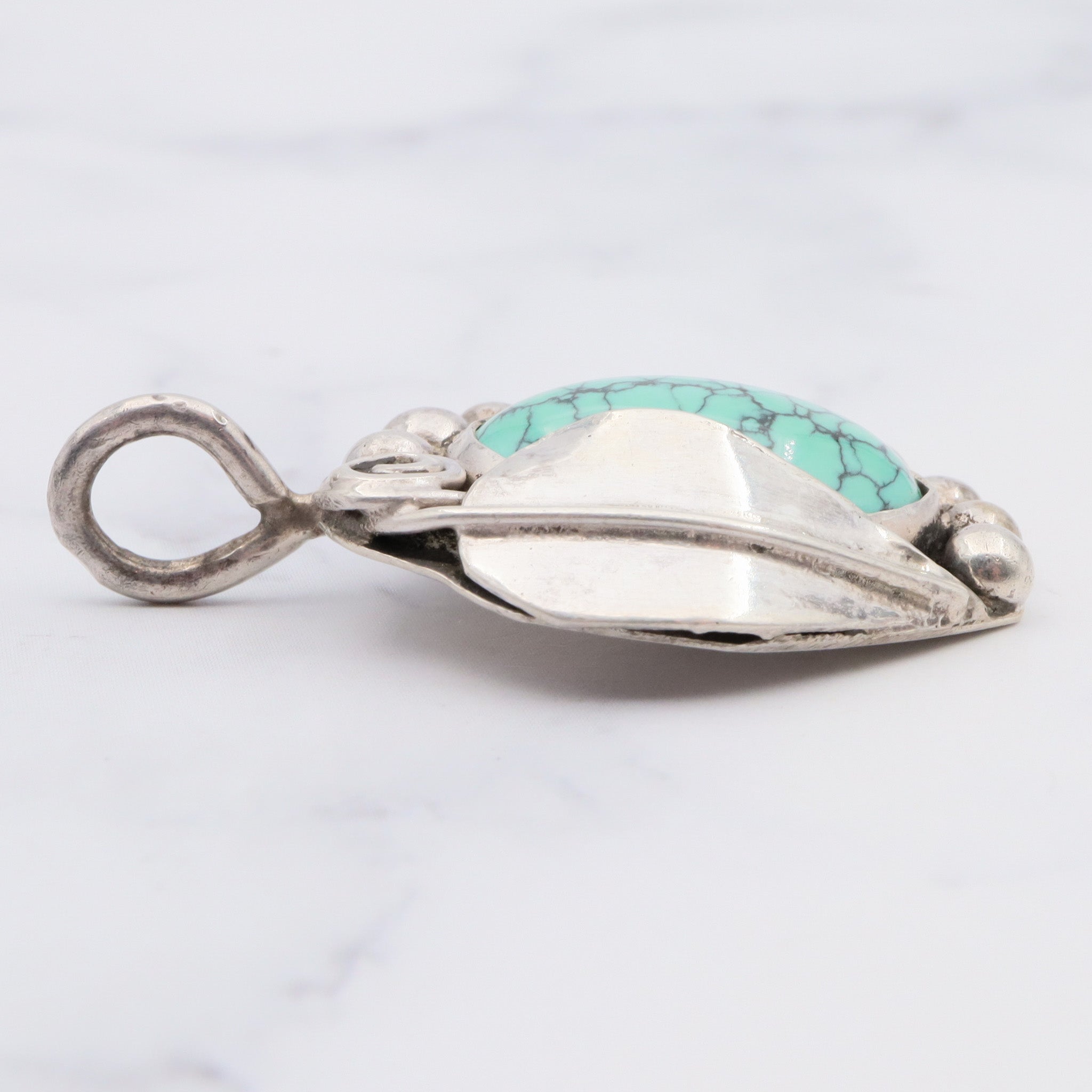 Native American sterling silver and turquoise handmade leaf pendant
