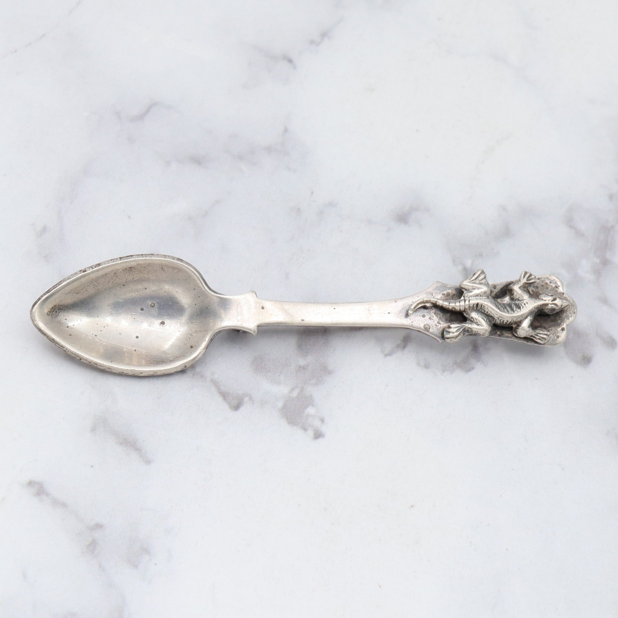 Antique sterling salt spoon brooch with figural lizard