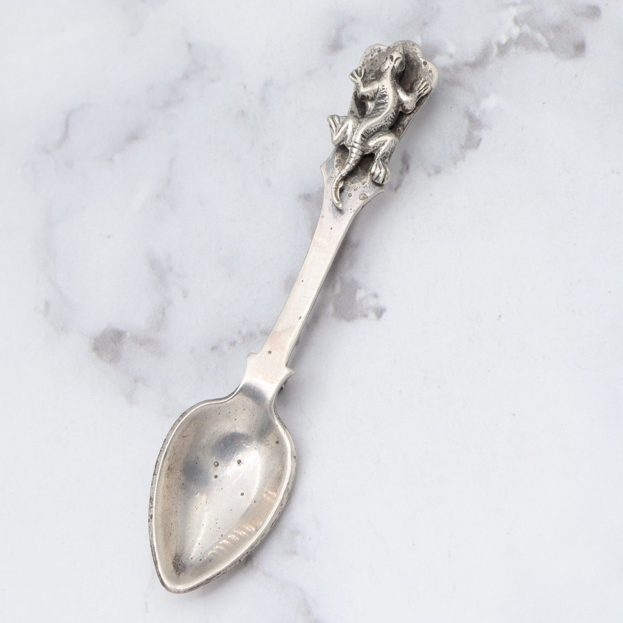 Antique sterling salt spoon brooch with figural lizard