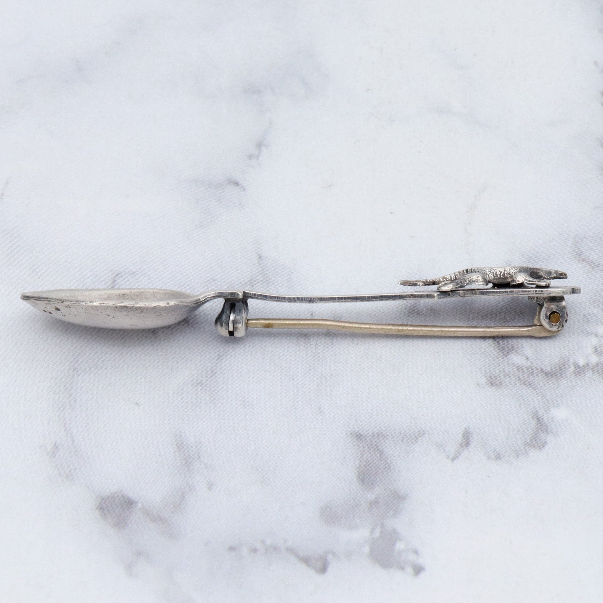 Antique sterling salt spoon brooch with figural lizard