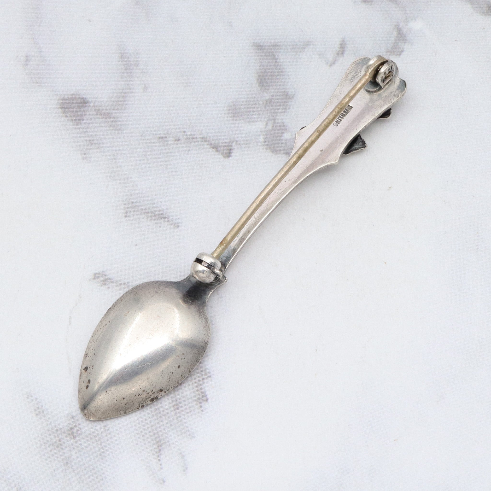 Antique sterling salt spoon brooch with figural lizard