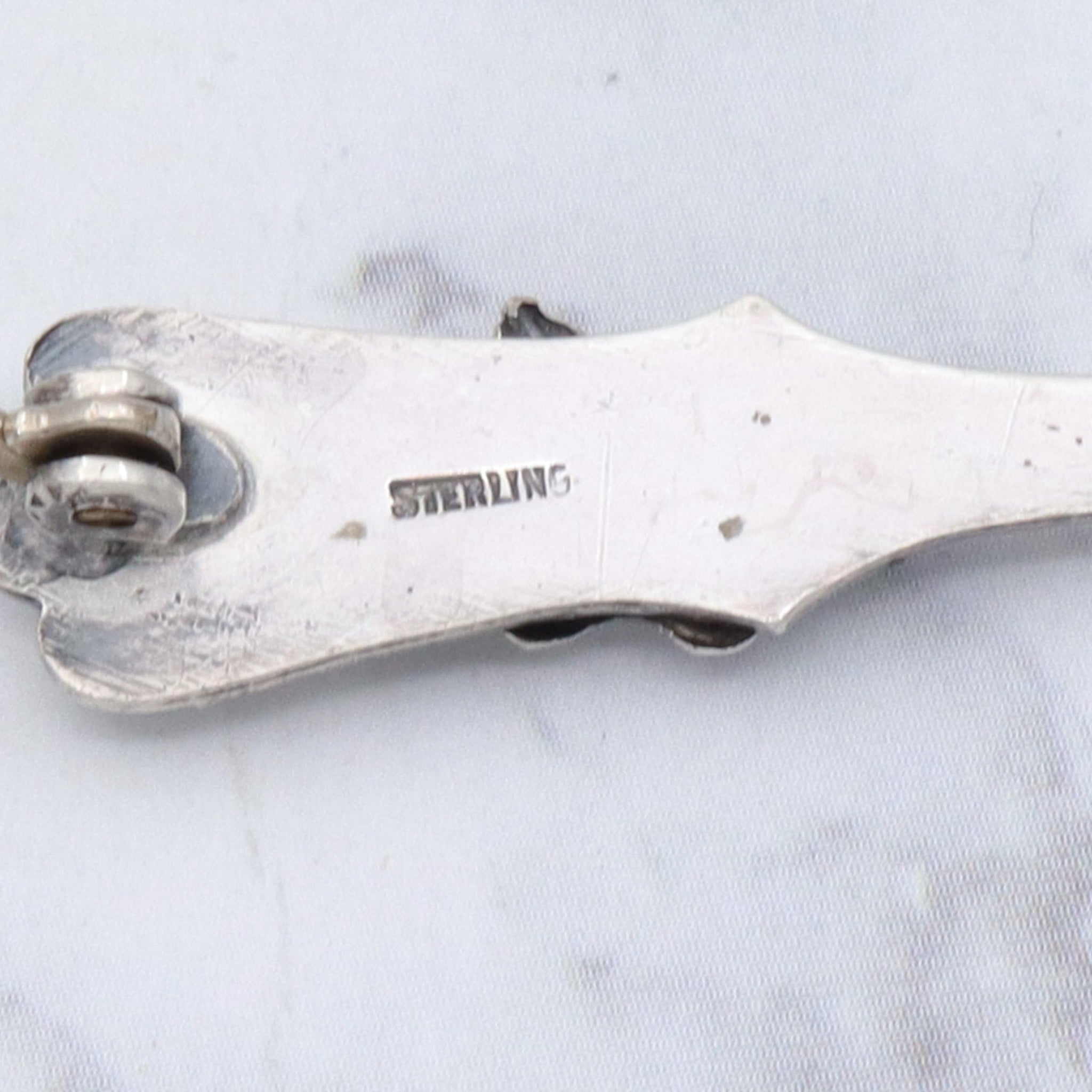 Antique sterling salt spoon brooch with figural lizard