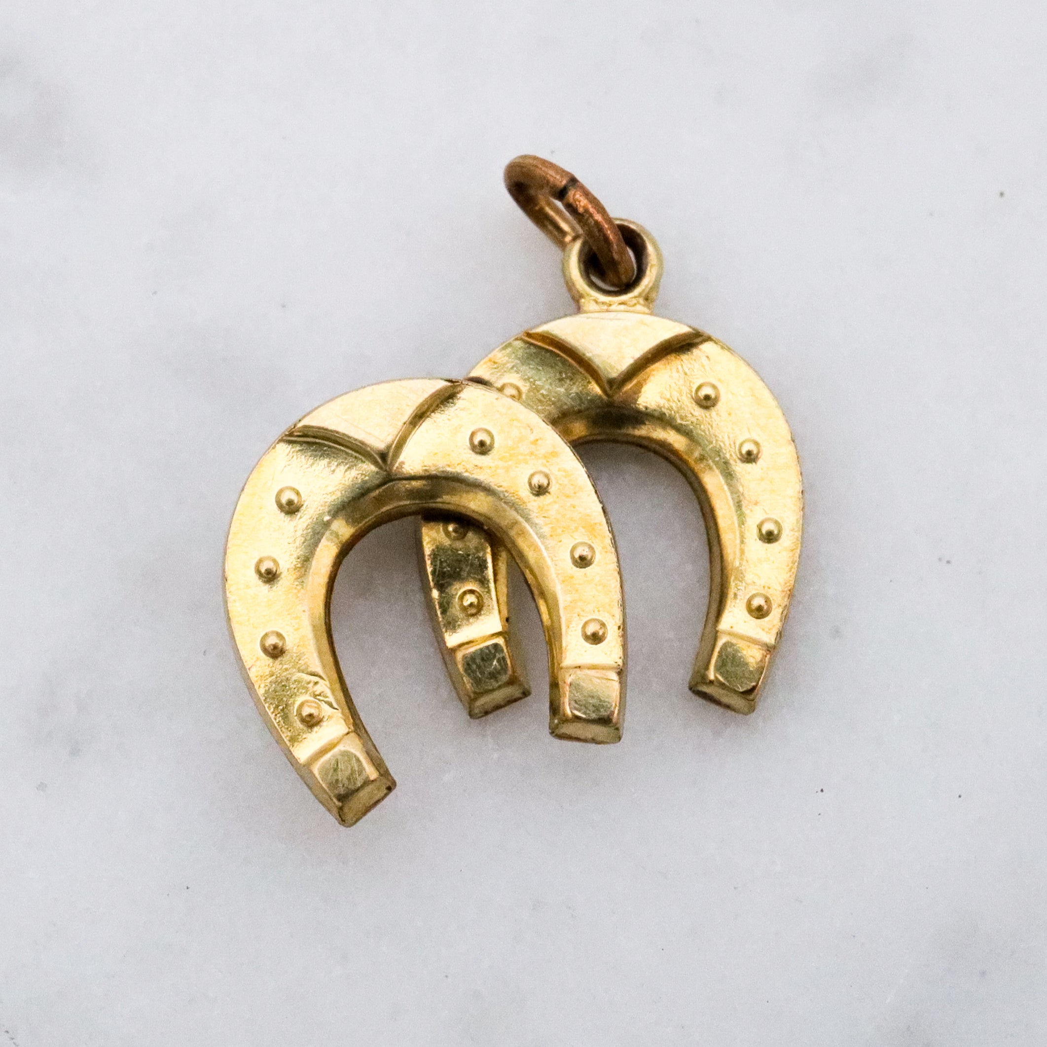 Antique rolled gold double horseshoe lucky charm pendant