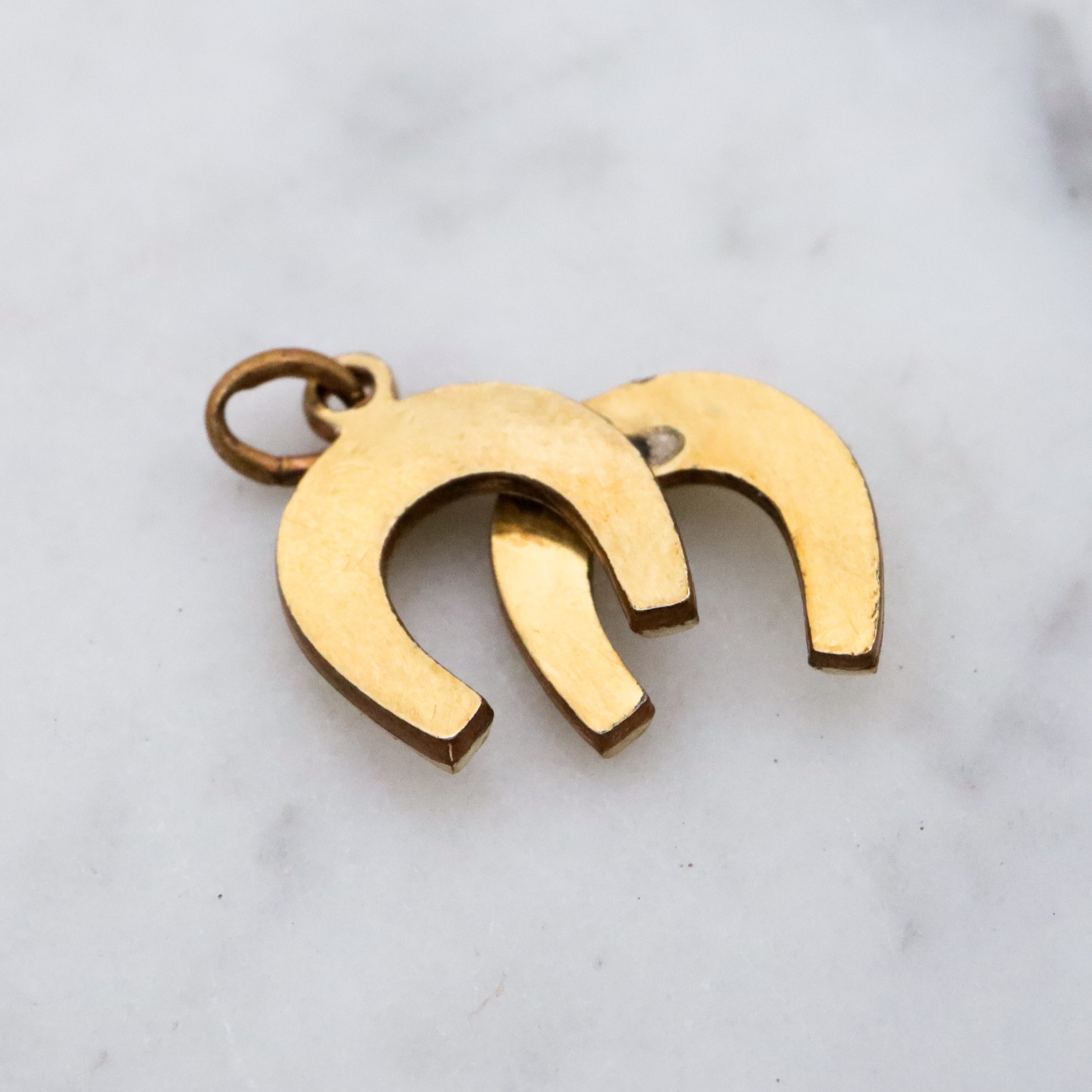 Antique rolled gold double horseshoe lucky charm pendant
