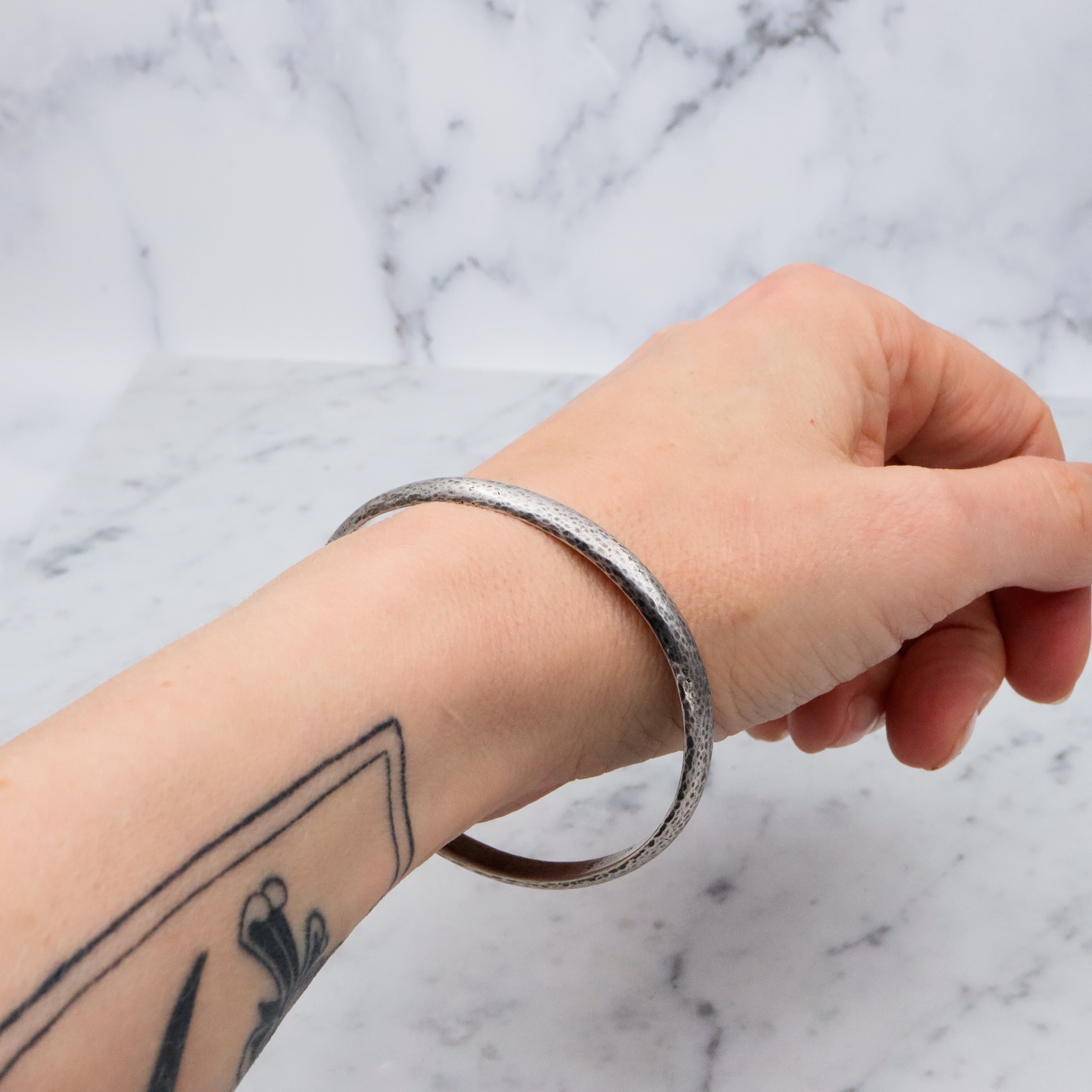 Mid Century hand hammered solid sterling oval bangle