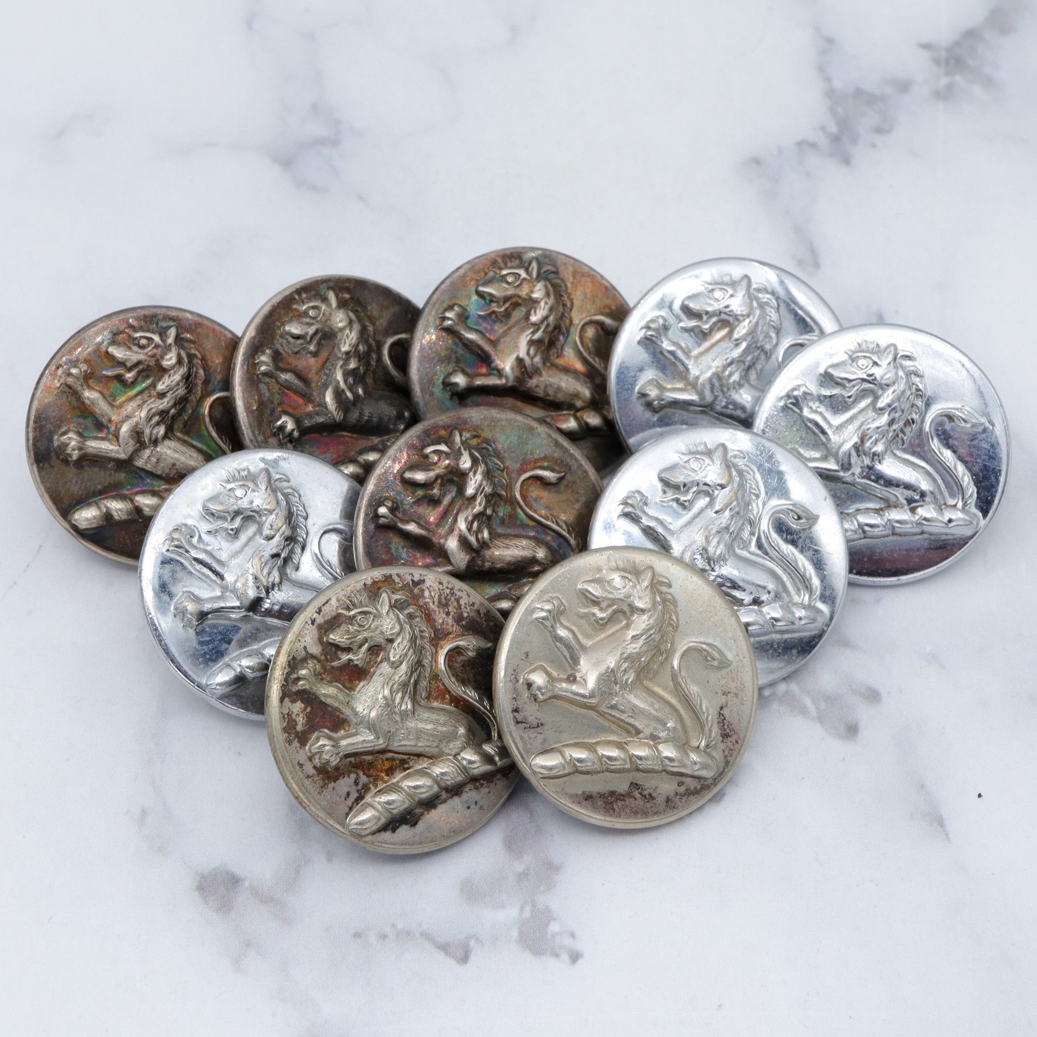 Large group of 28 Antique silver-plated brass livery buttons with rampant lion