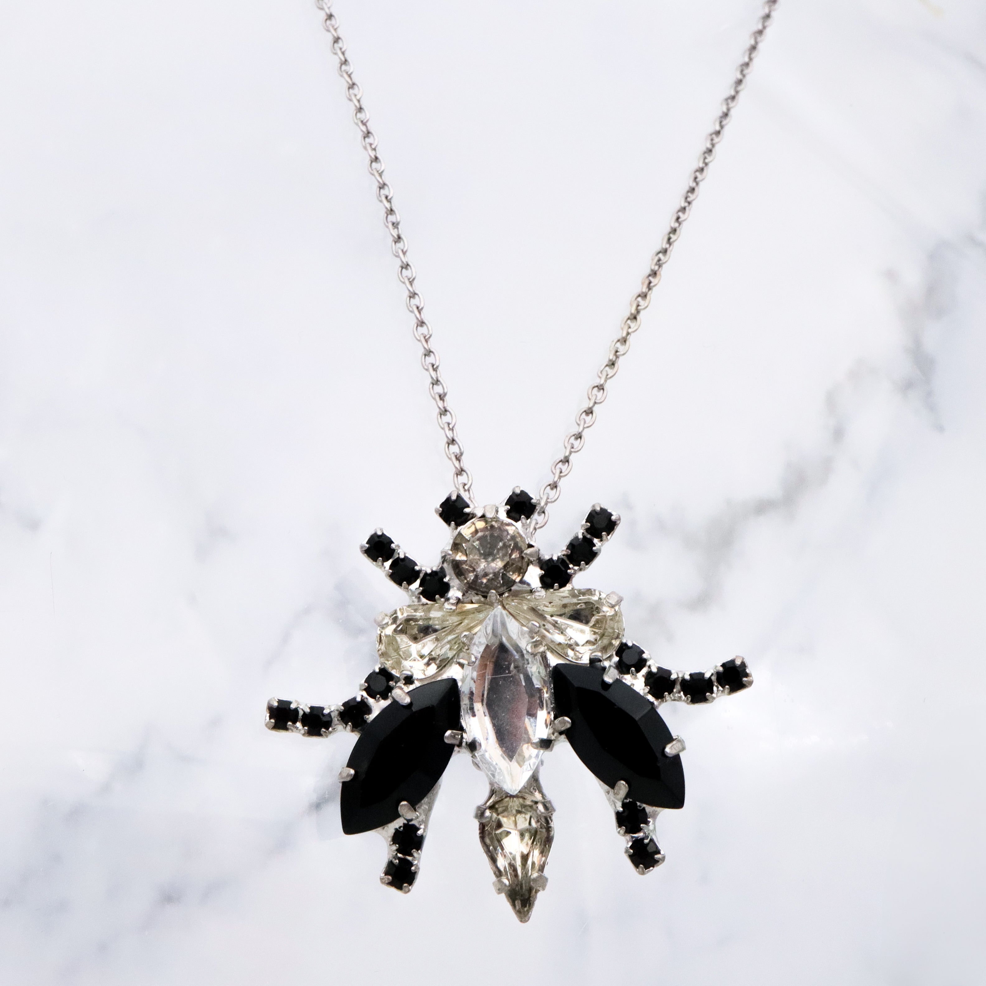Vintage black & clear rhinestone bug brooch
