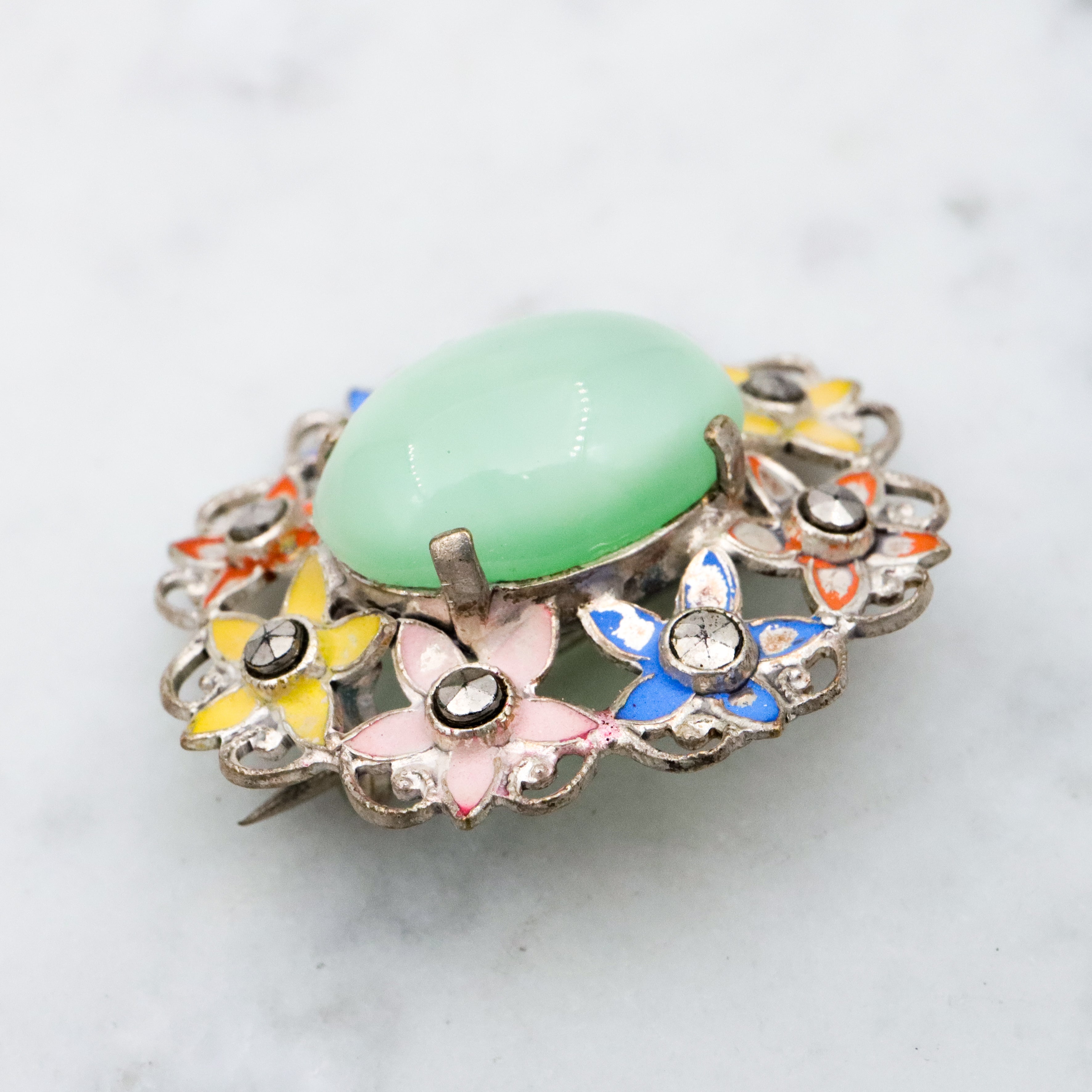 Antique Art Deco green cats eye enamel flower brooch