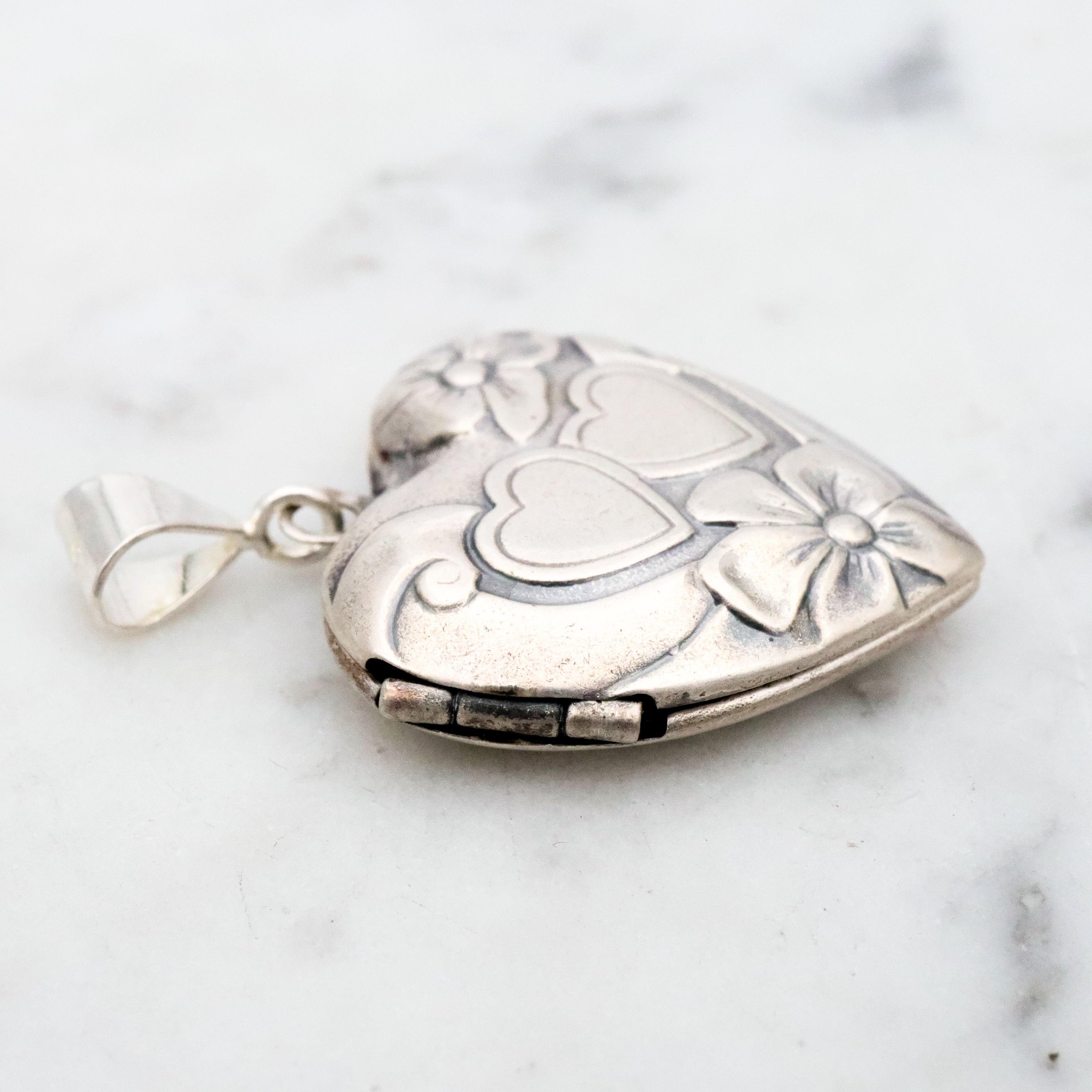 Antique sterling sweetheart locket pendant