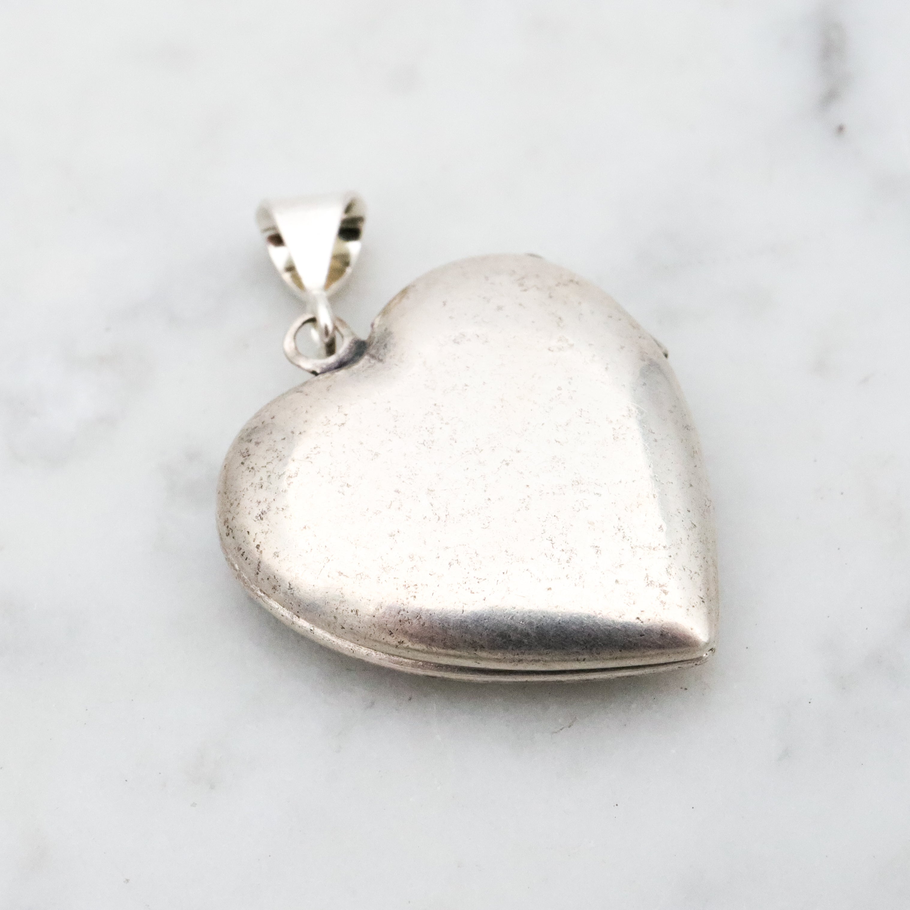 Antique sterling sweetheart locket pendant