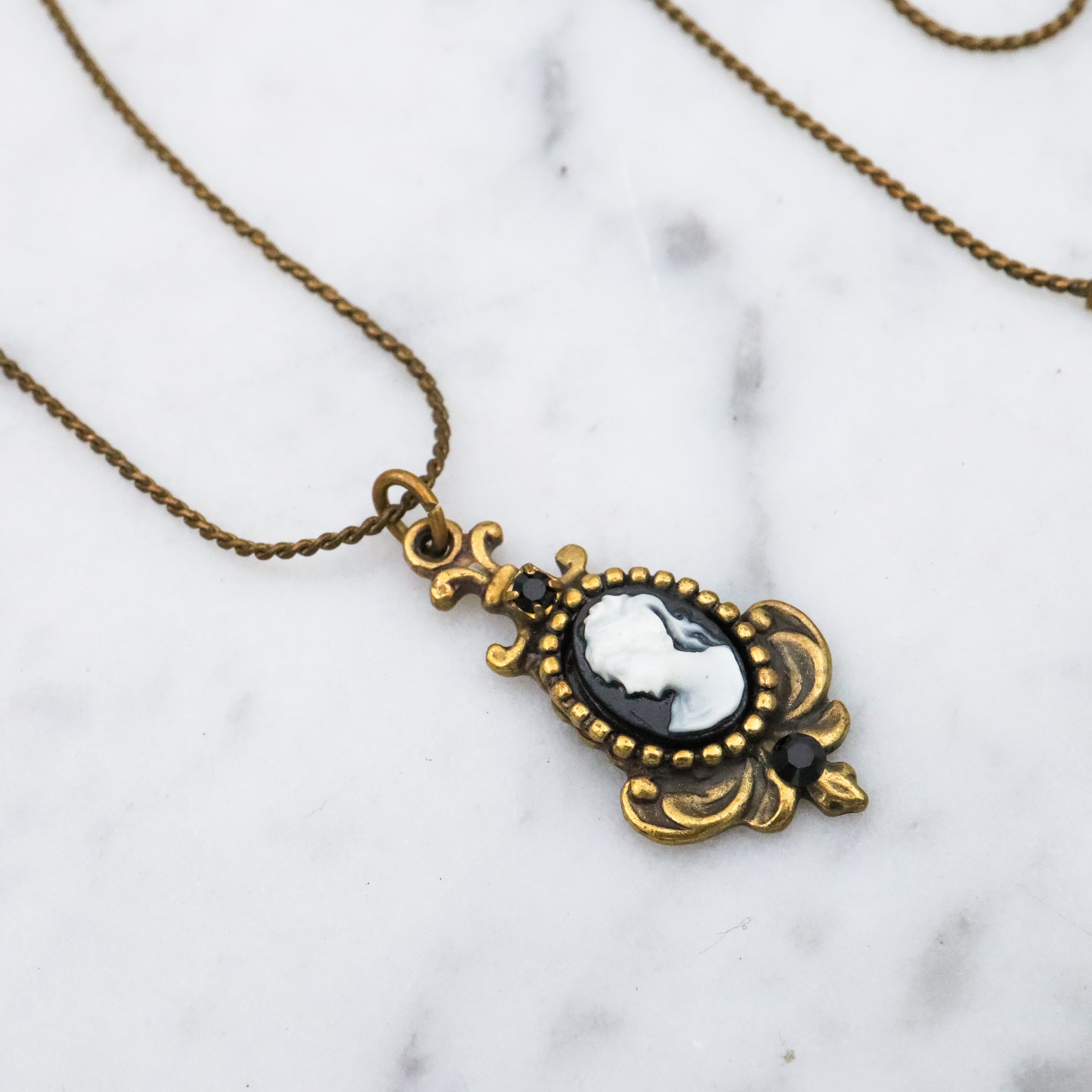 Retro Michal Negrin black & white cameo brass necklace