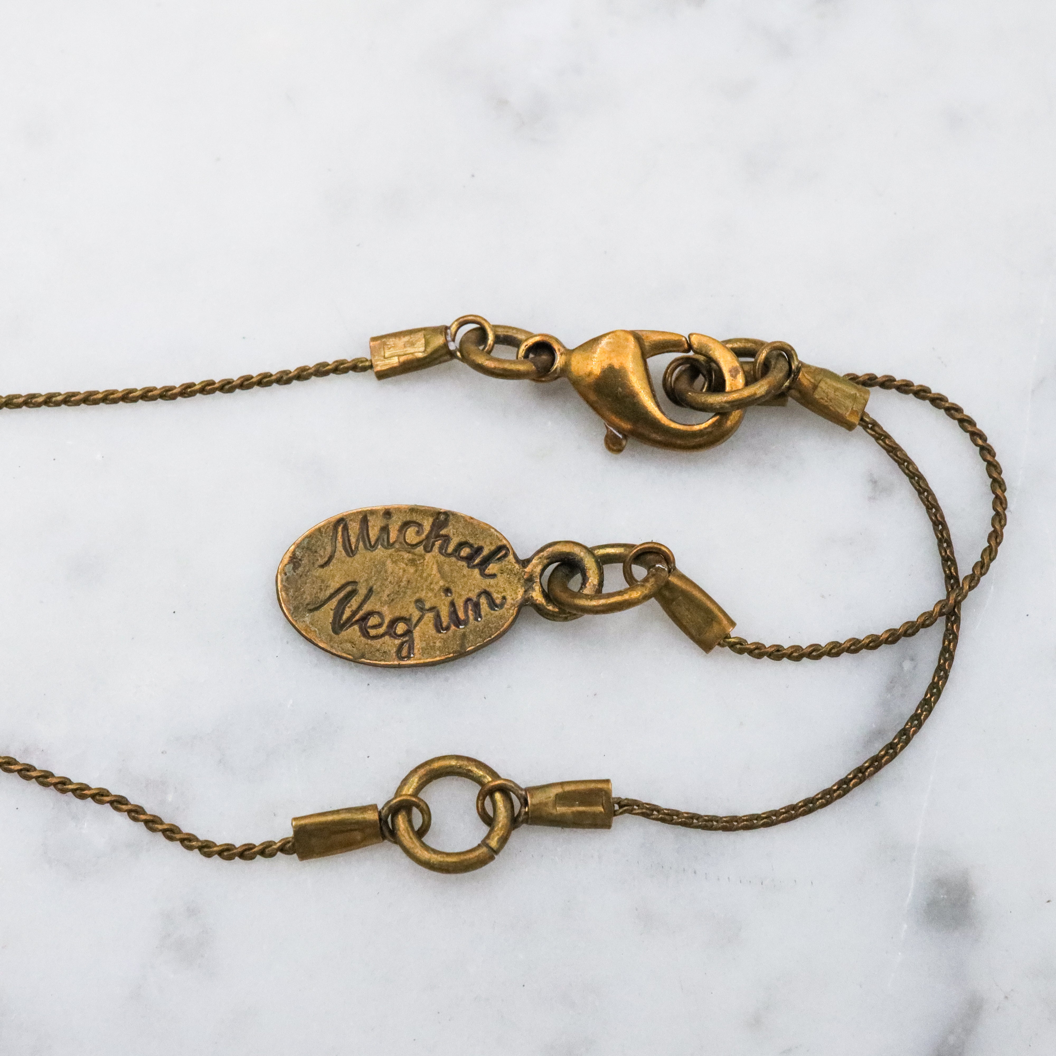 Retro Michal Negrin black & white cameo brass necklace