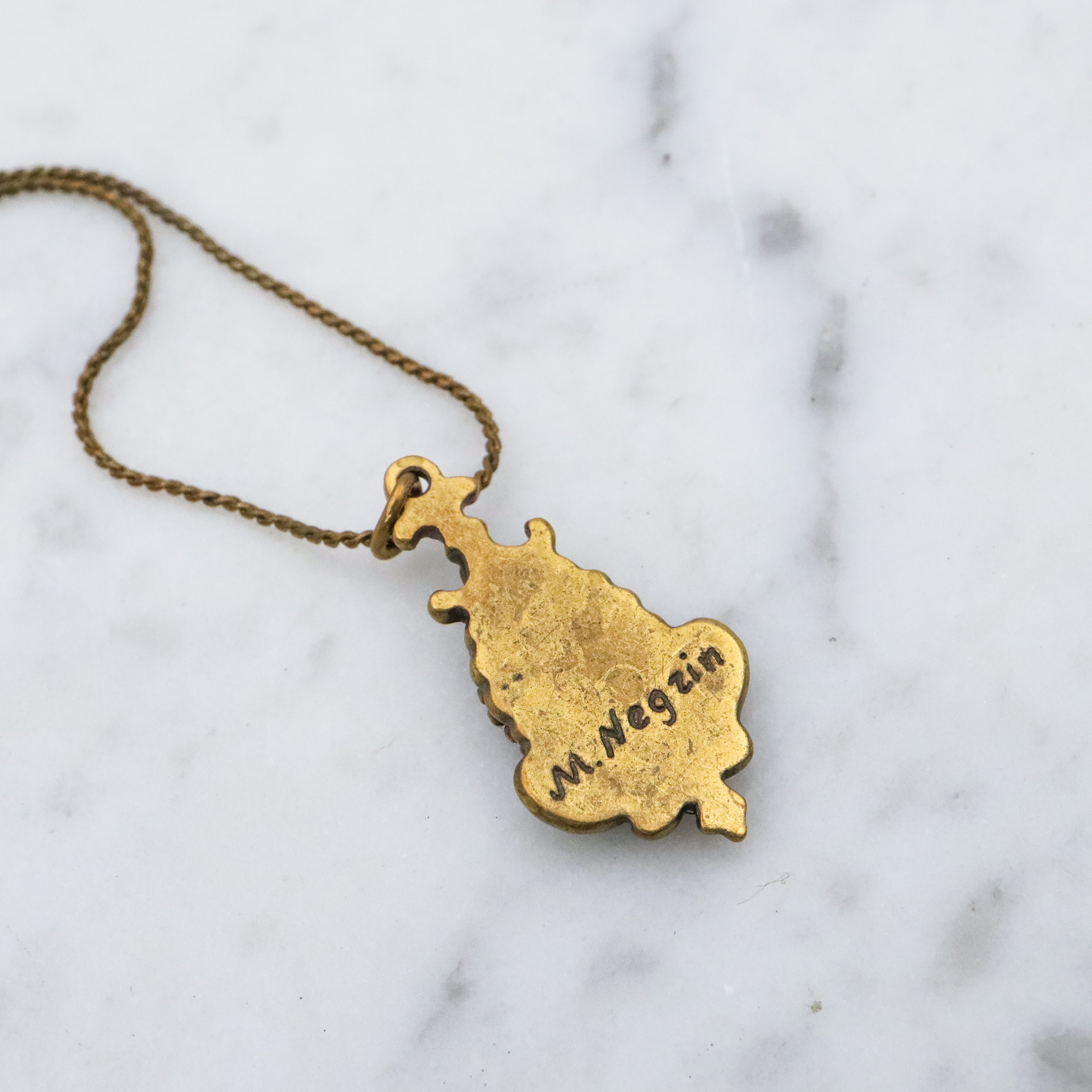 Retro Michal Negrin black & white cameo brass necklace