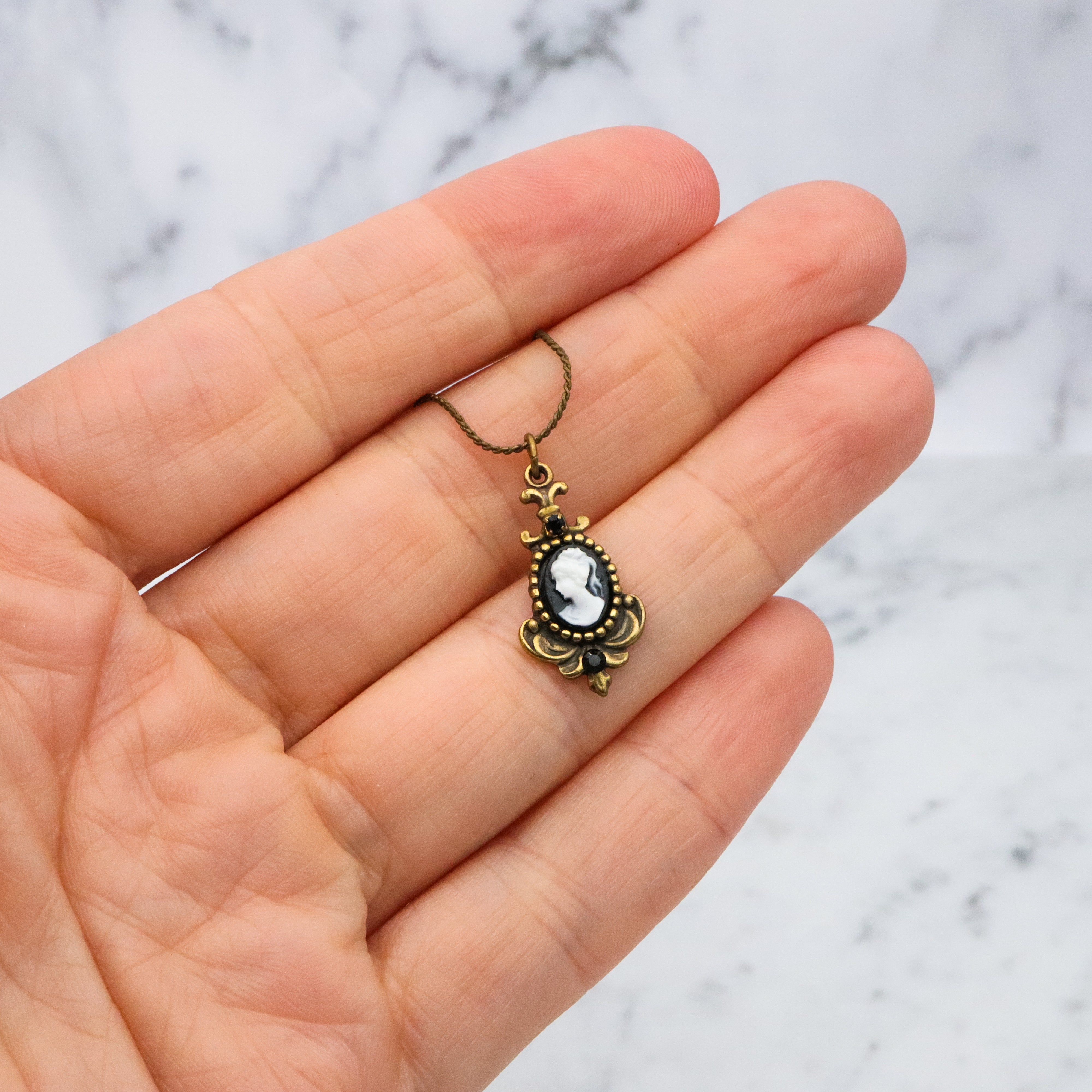 Retro Michal Negrin black & white cameo brass necklace