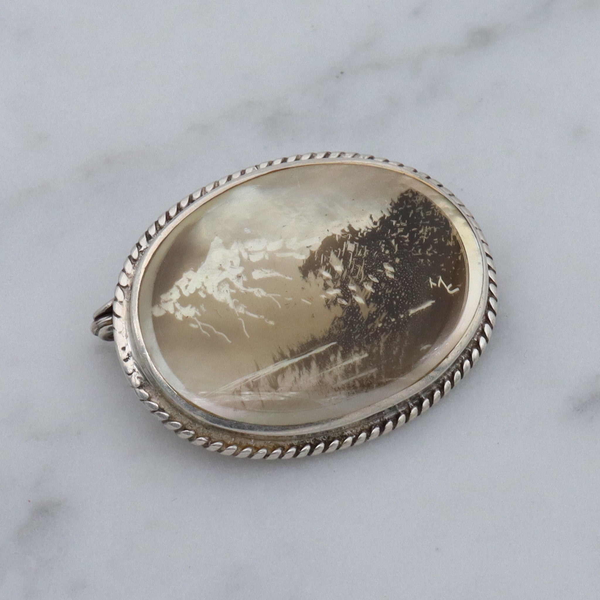 Vintage transfer printed miniature painting on mother of pearl and sterling brooch