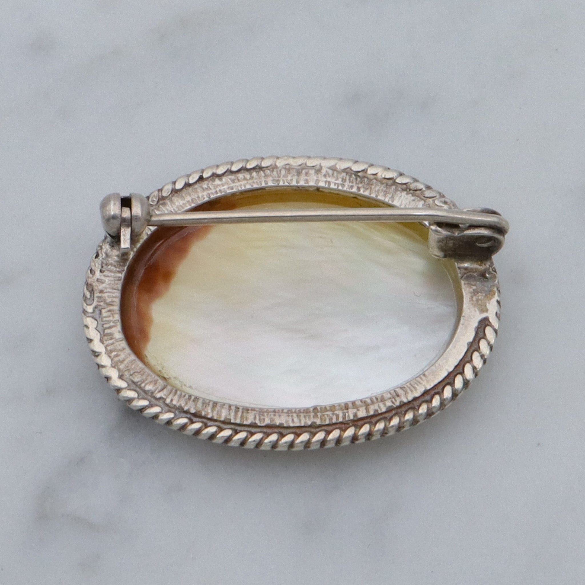 Vintage transfer printed miniature painting on mother of pearl and sterling brooch