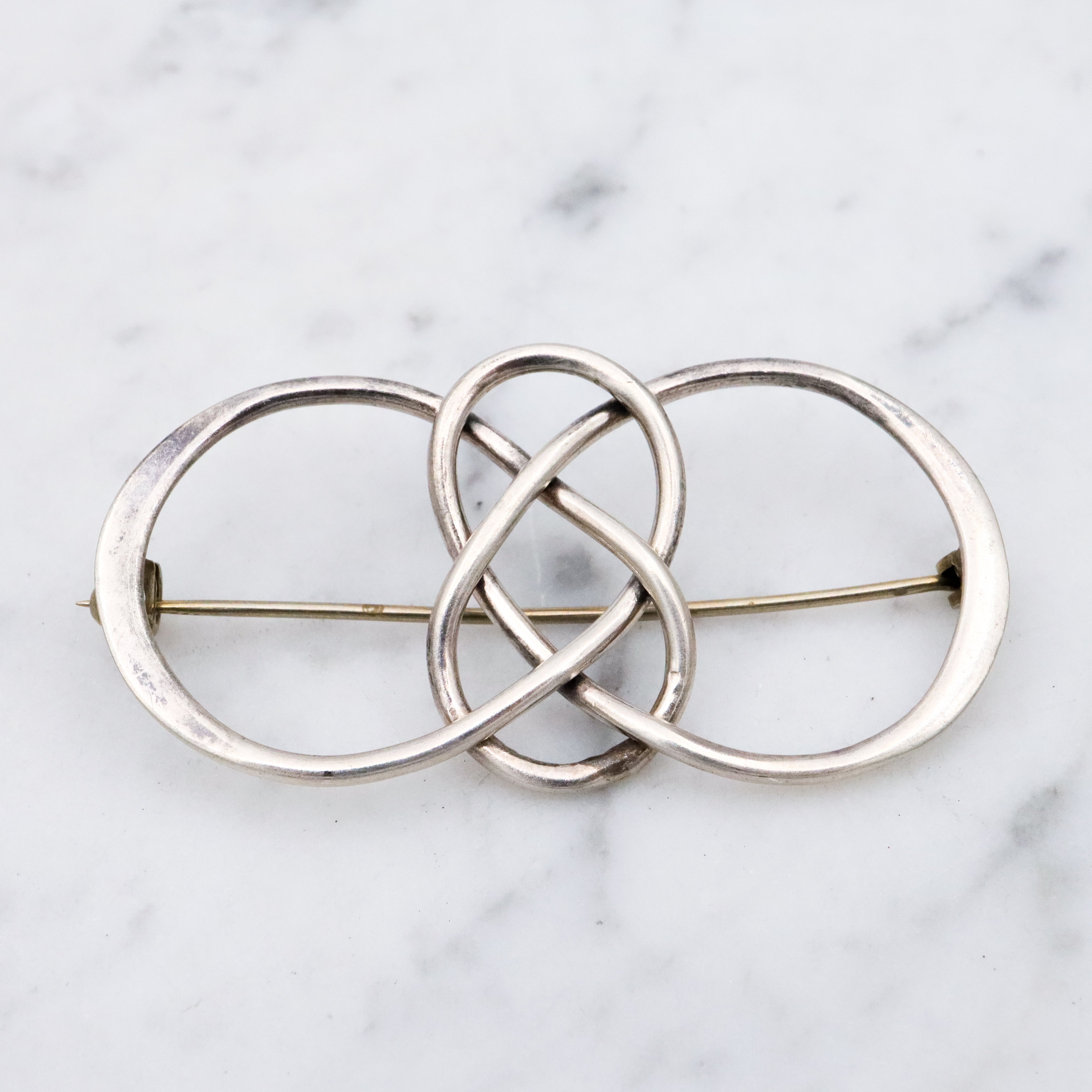 Vintage sterling elongated celtic knot brooch