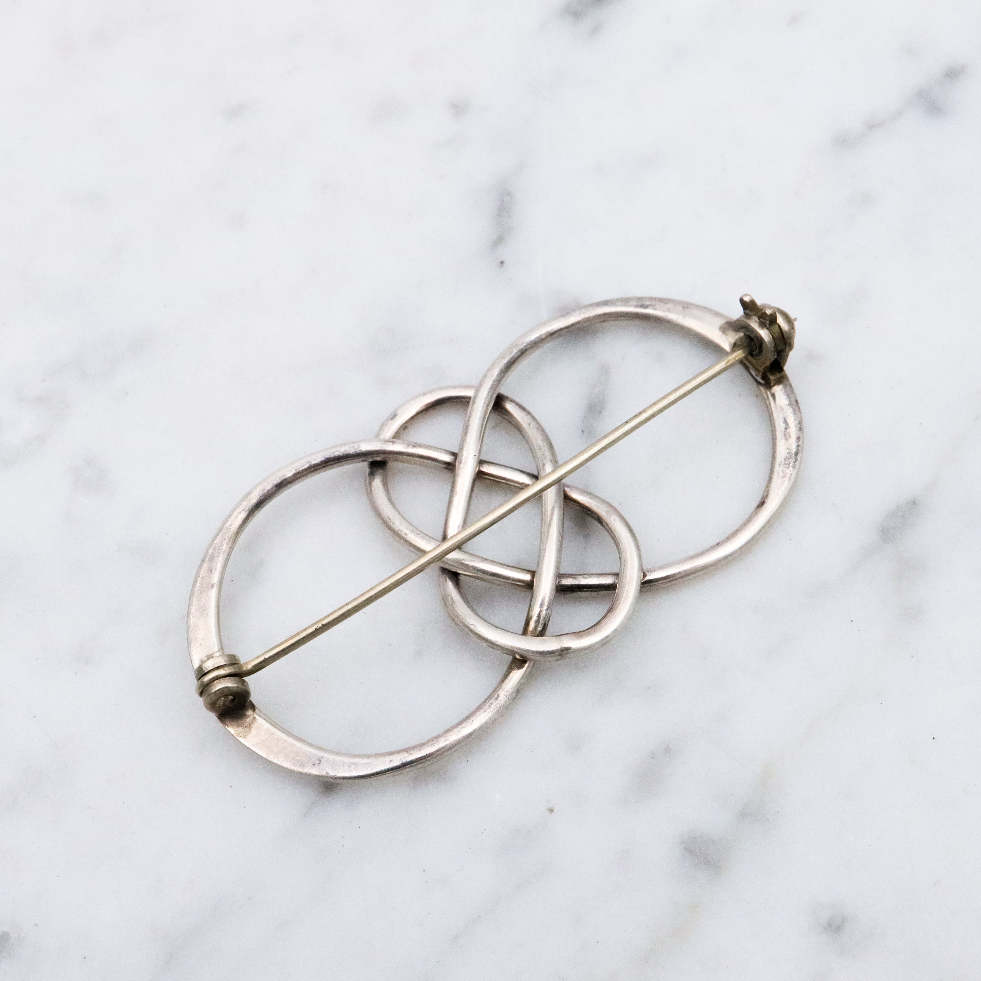 Vintage sterling elongated celtic knot brooch