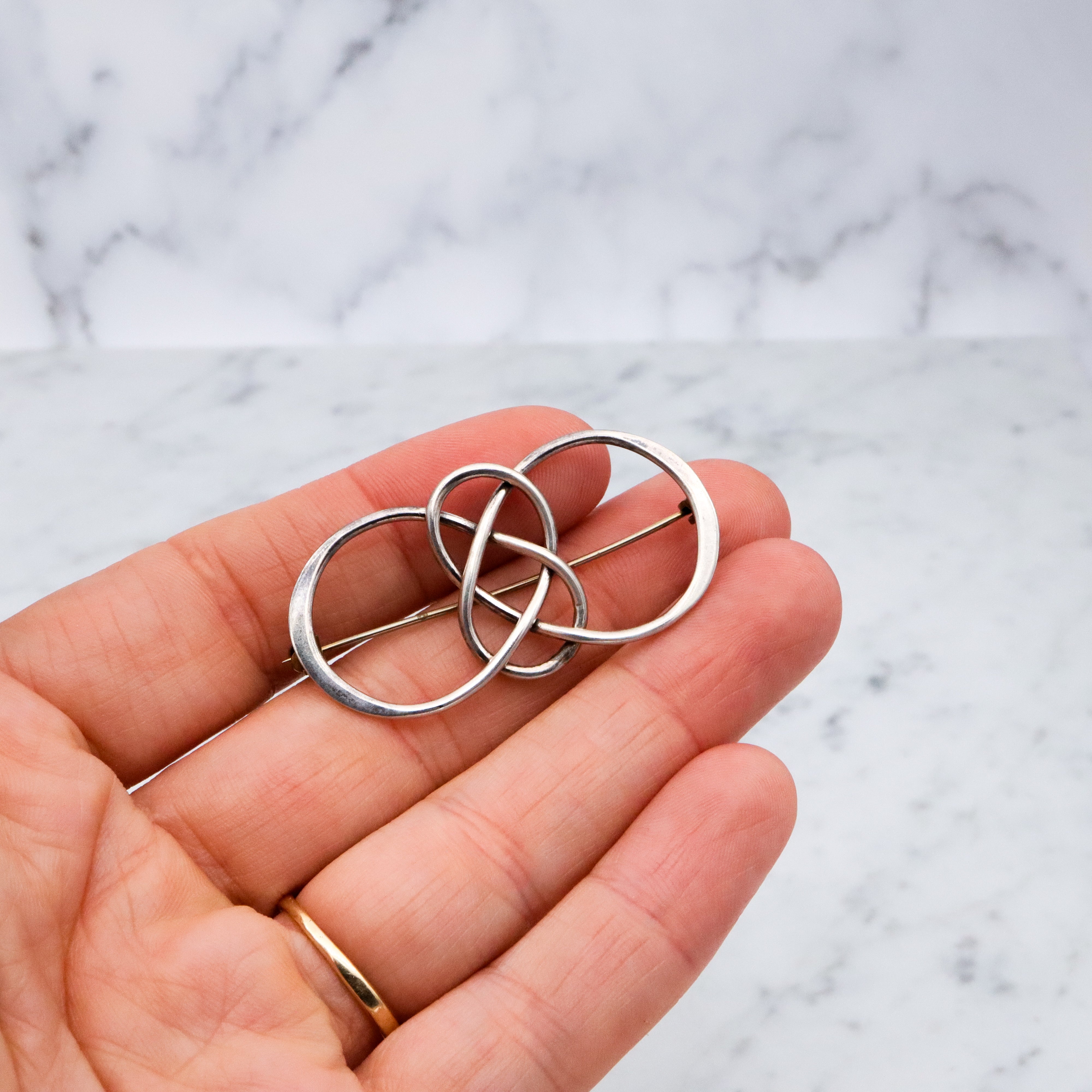 Vintage sterling elongated celtic knot brooch