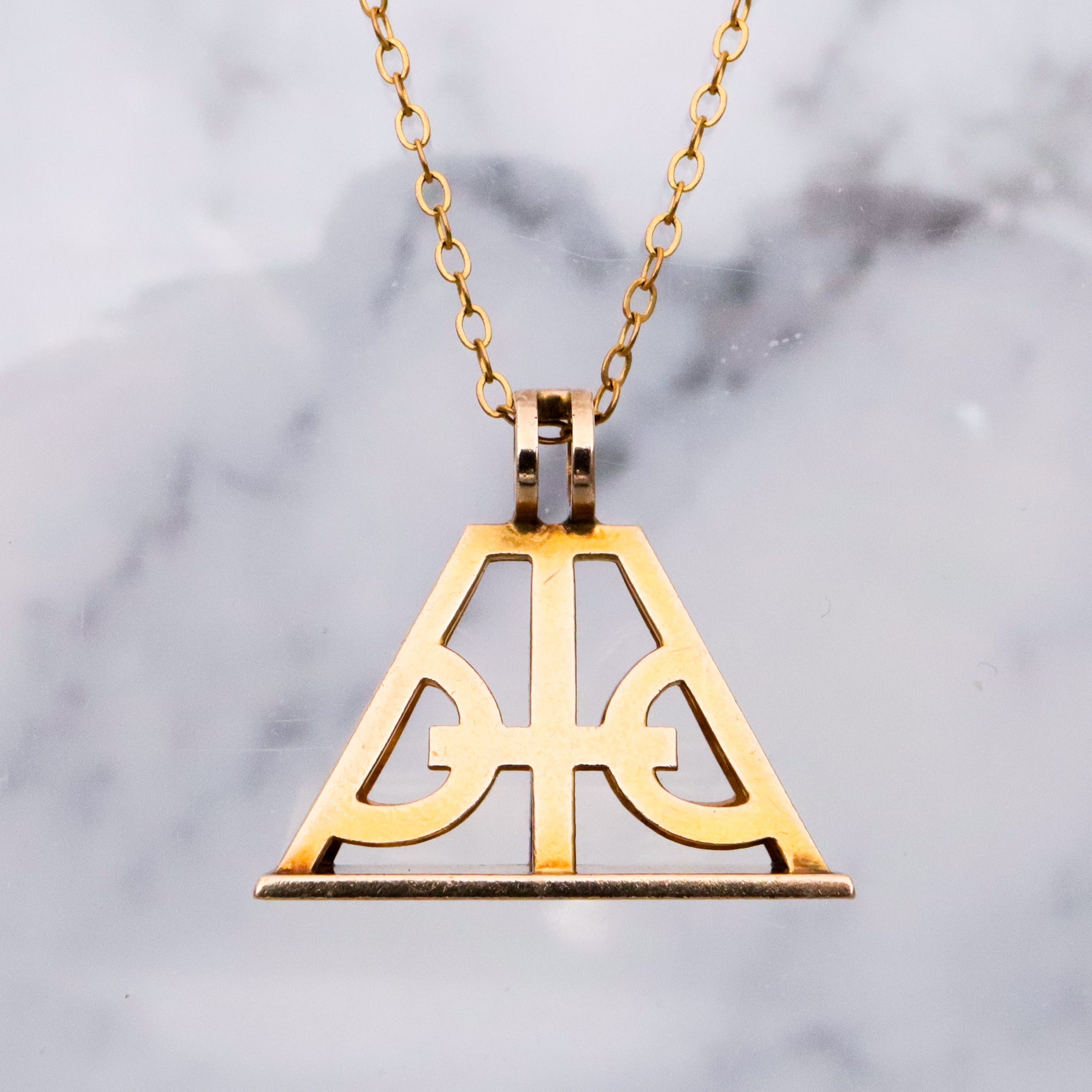 Antique Victorian 10k gold geometric cutout fob pendant