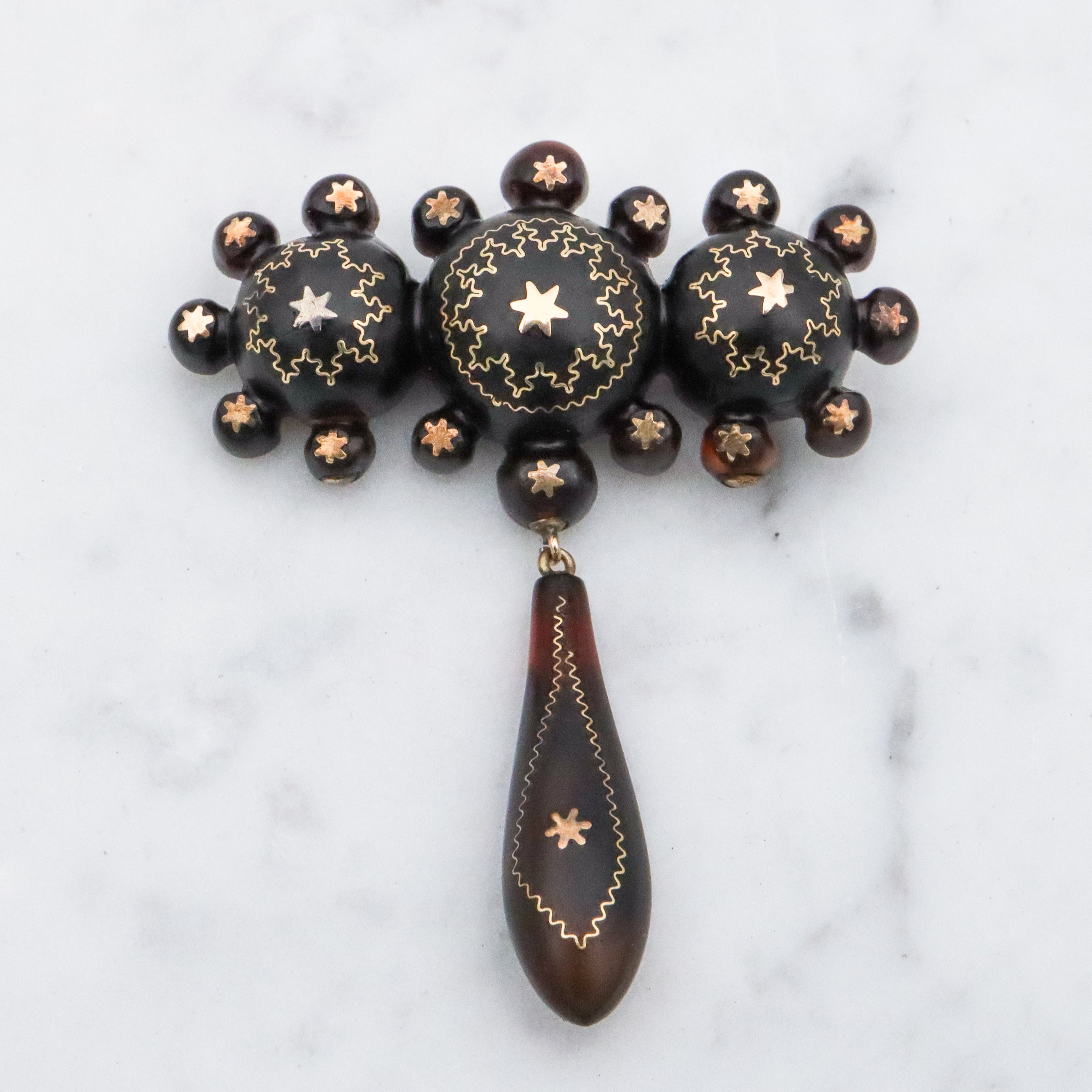 Antique Victorian tortoiseshell gold pique inlay star brooch