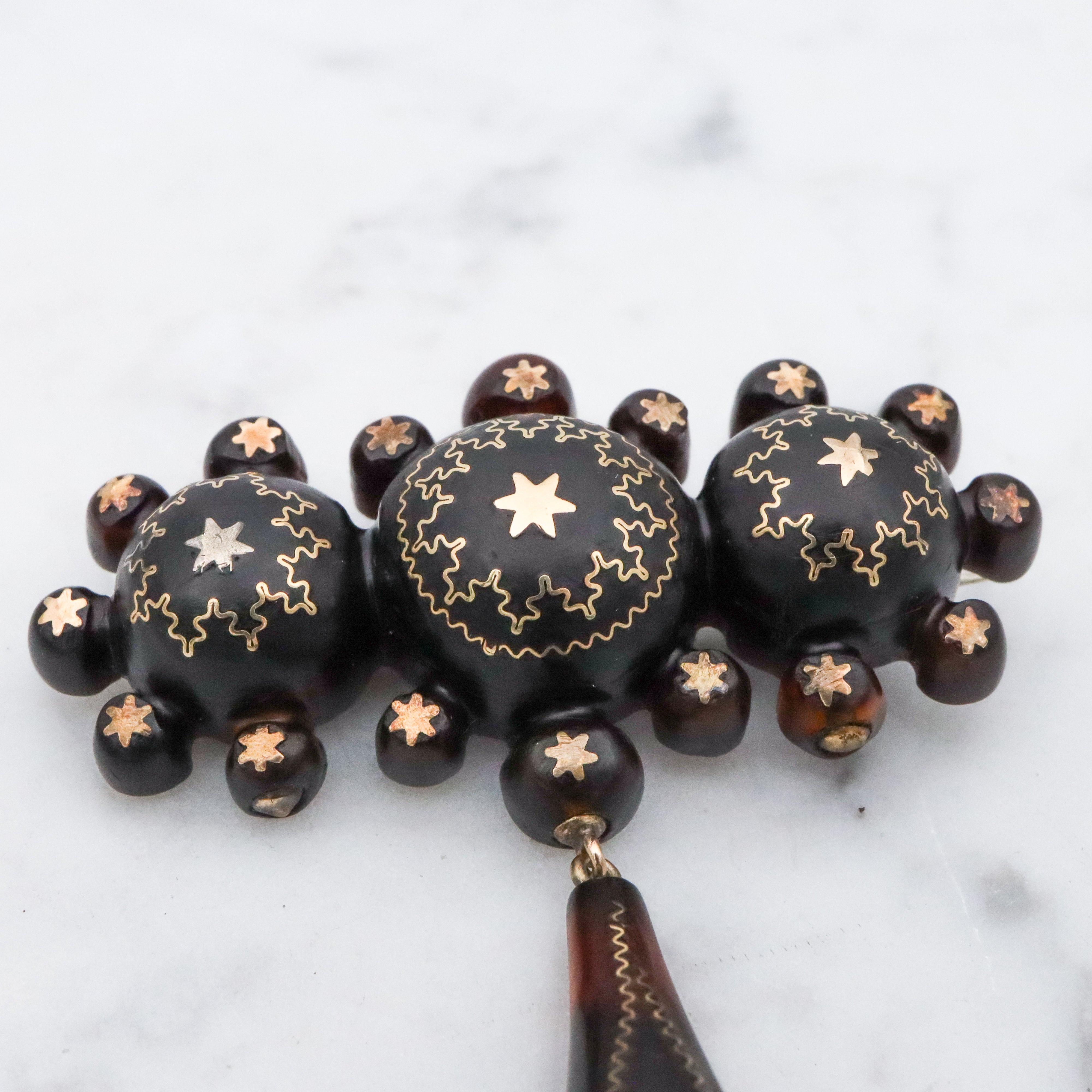 Antique Victorian tortoiseshell gold pique inlay star brooch