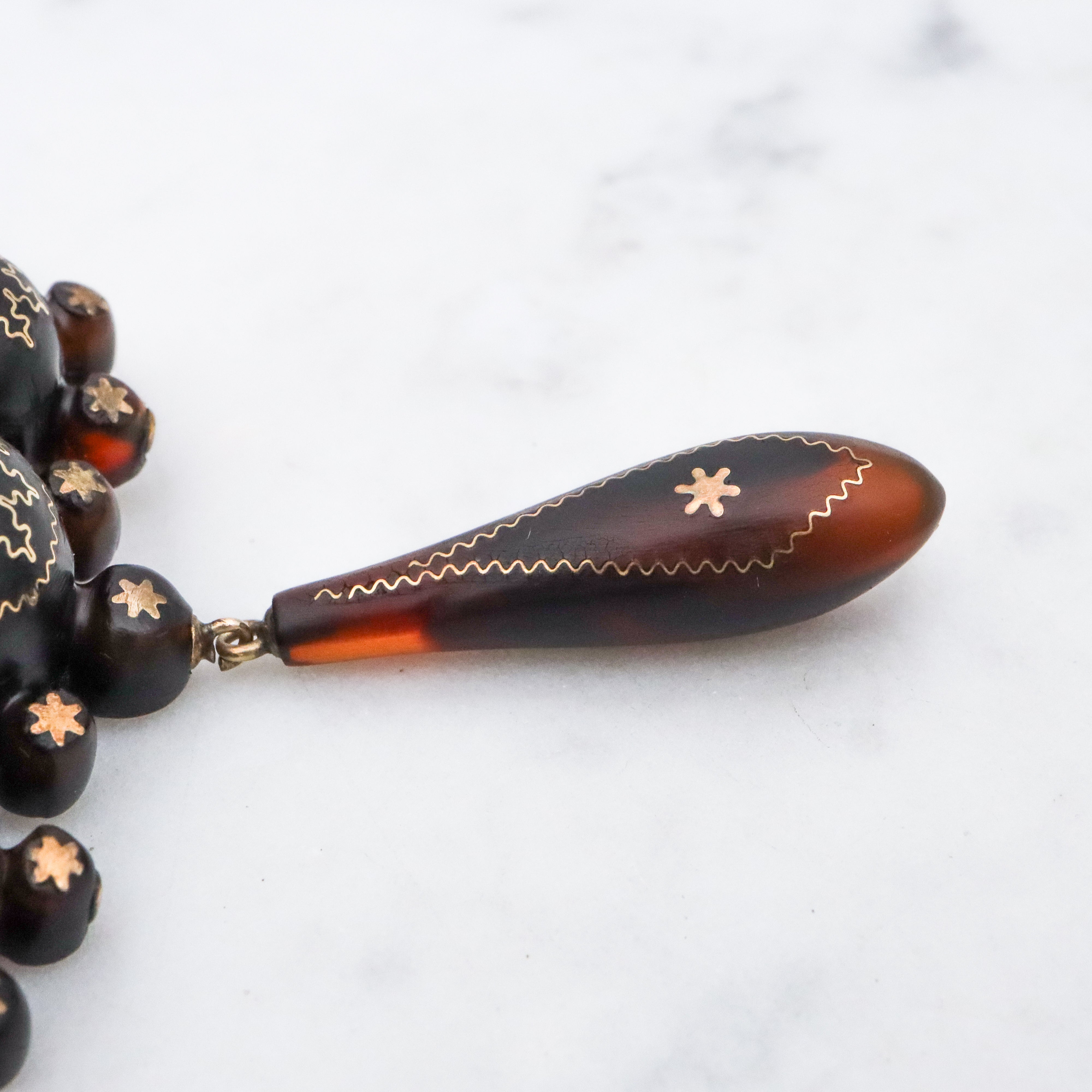 Antique Victorian tortoiseshell gold pique inlay star brooch
