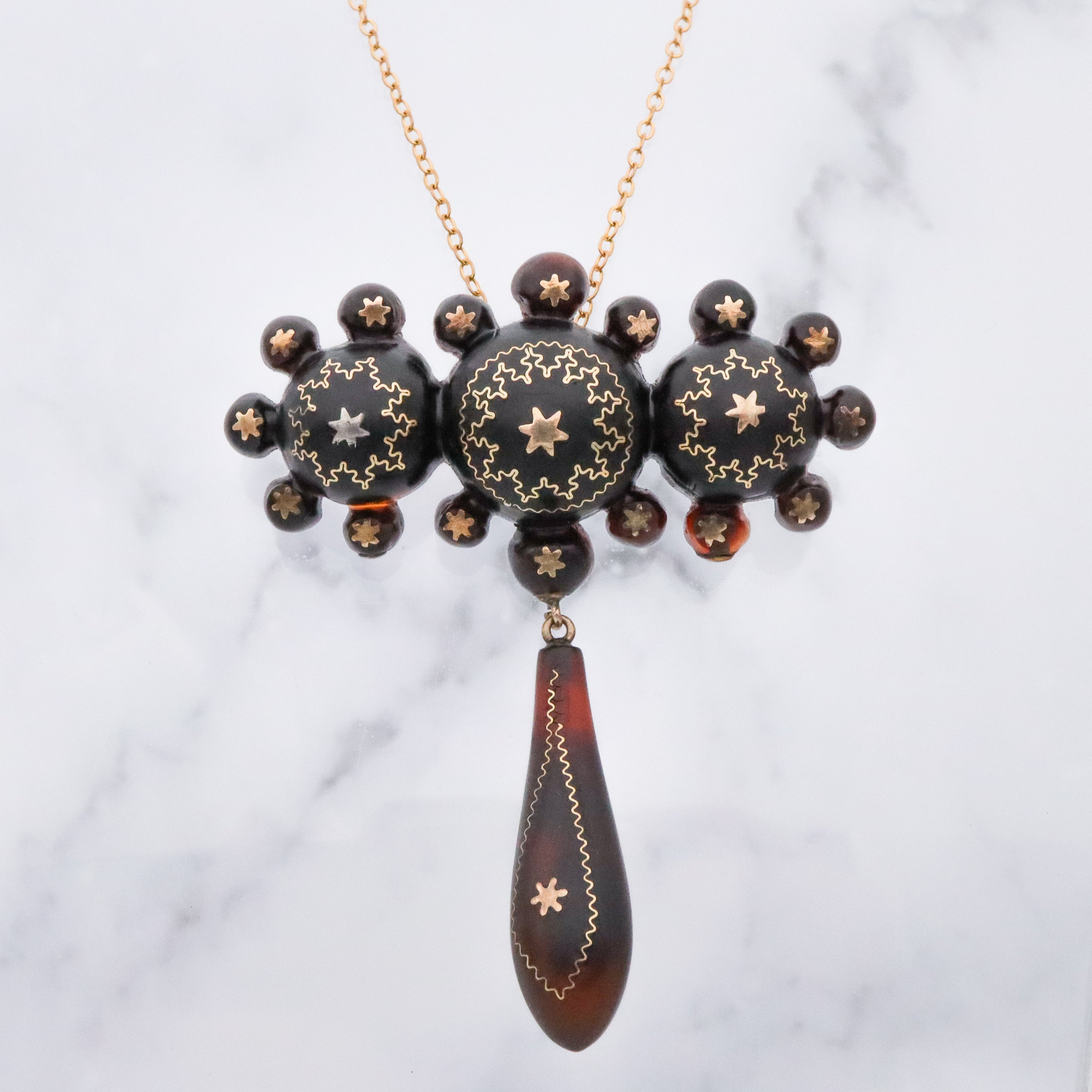 Antique Victorian tortoiseshell gold pique inlay star brooch