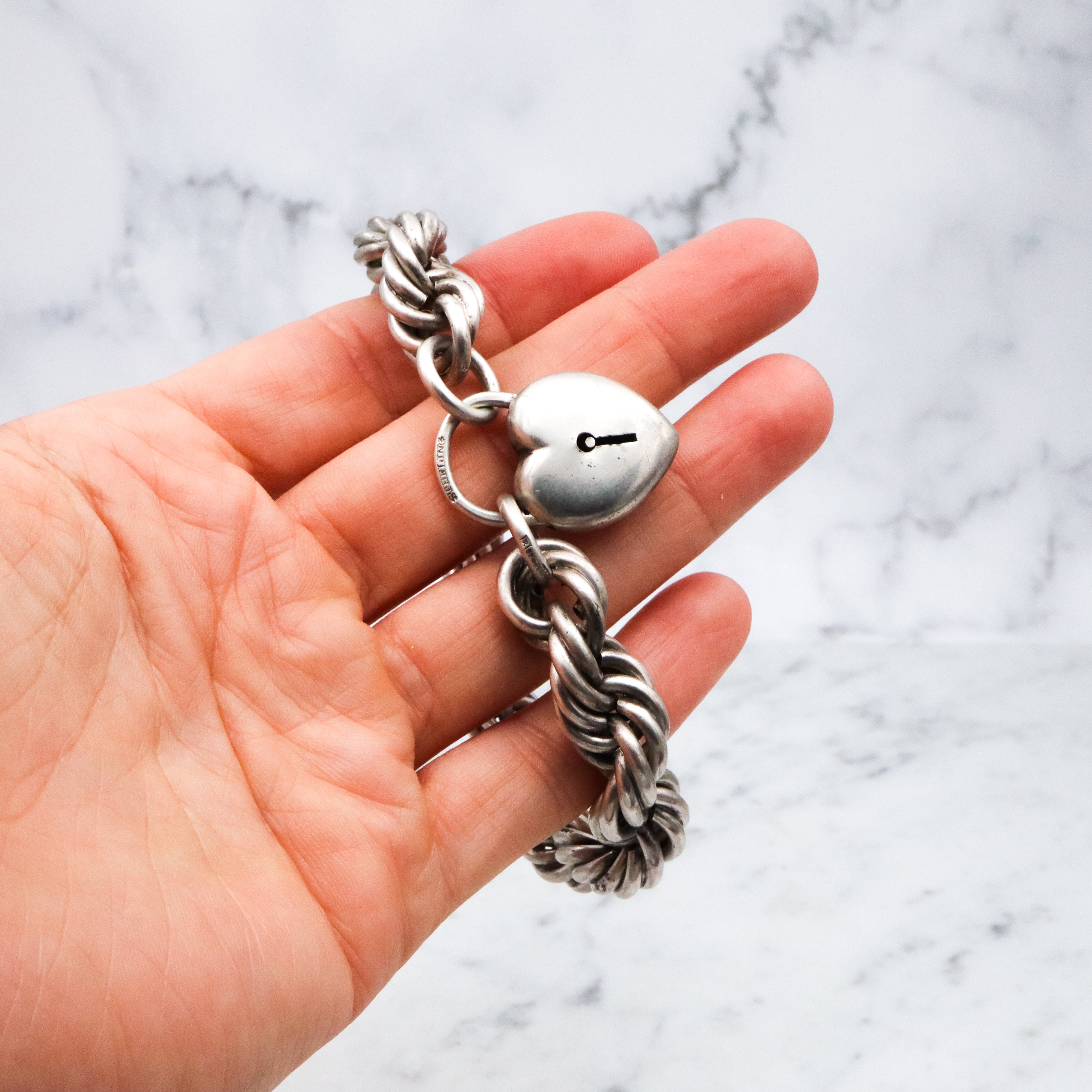 Rare Edwardian sterling Simons Bros thick rope bracelet with heart padlock