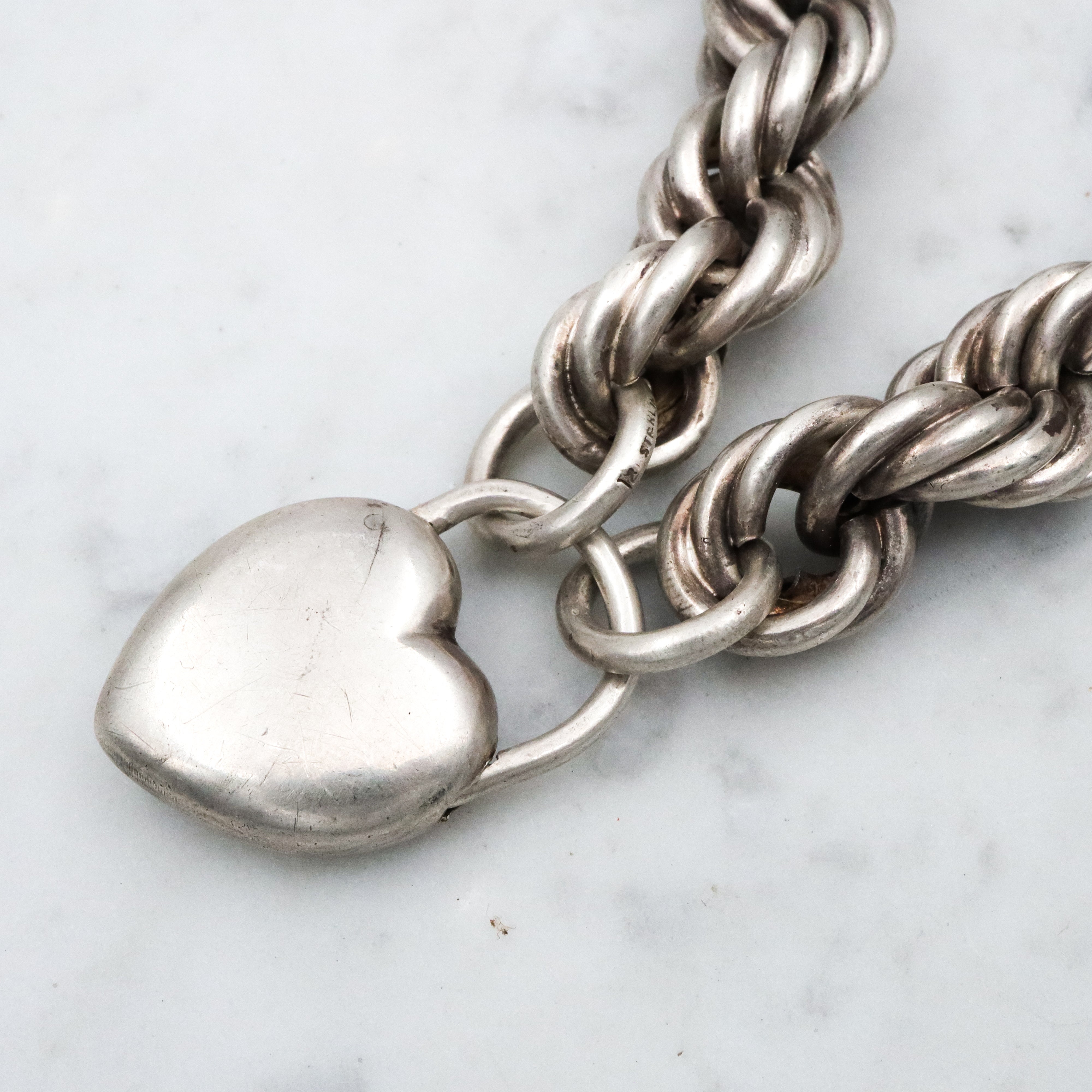 Rare Edwardian sterling Simons Bros thick rope bracelet with heart padlock