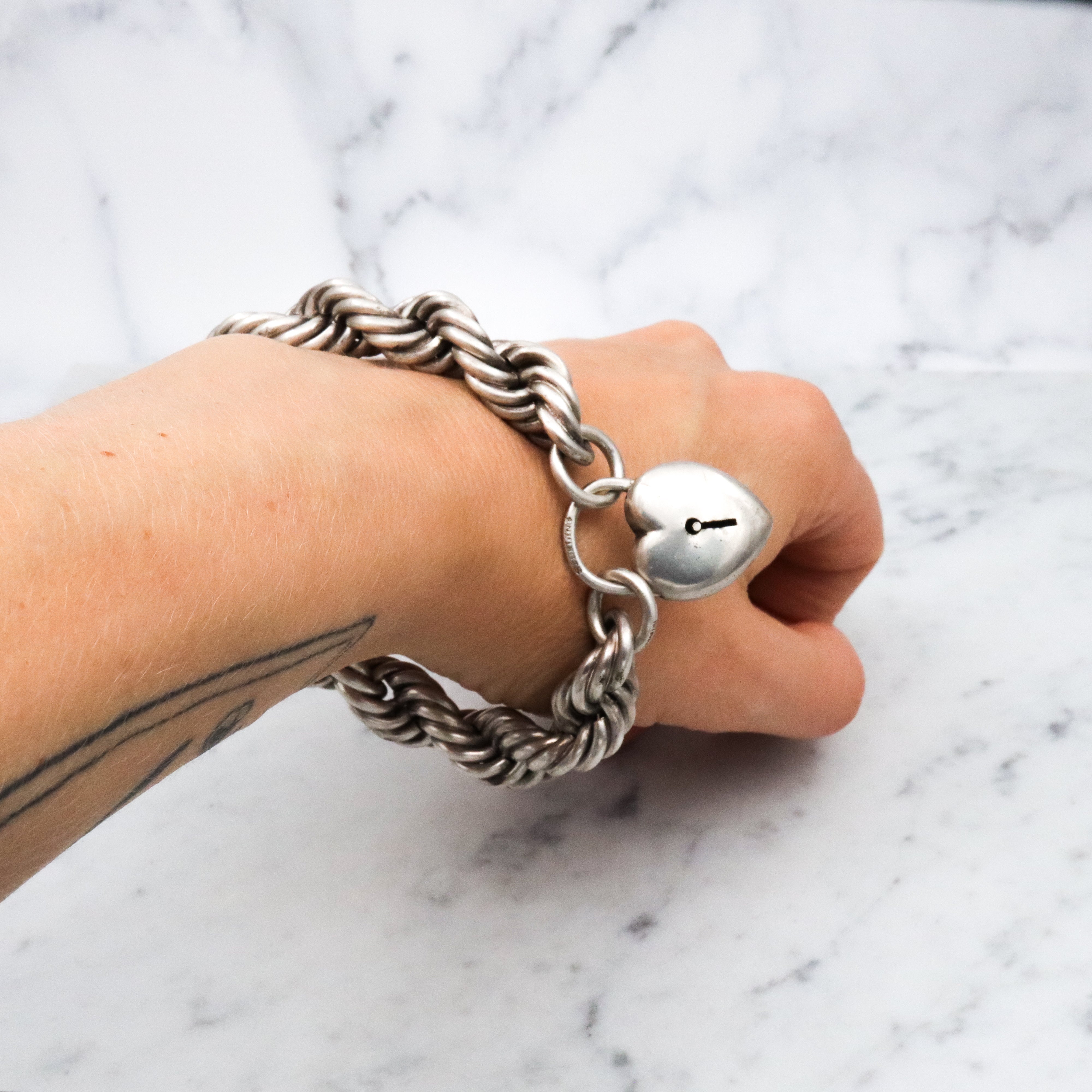 Rare Edwardian sterling Simons Bros thick rope bracelet with heart padlock