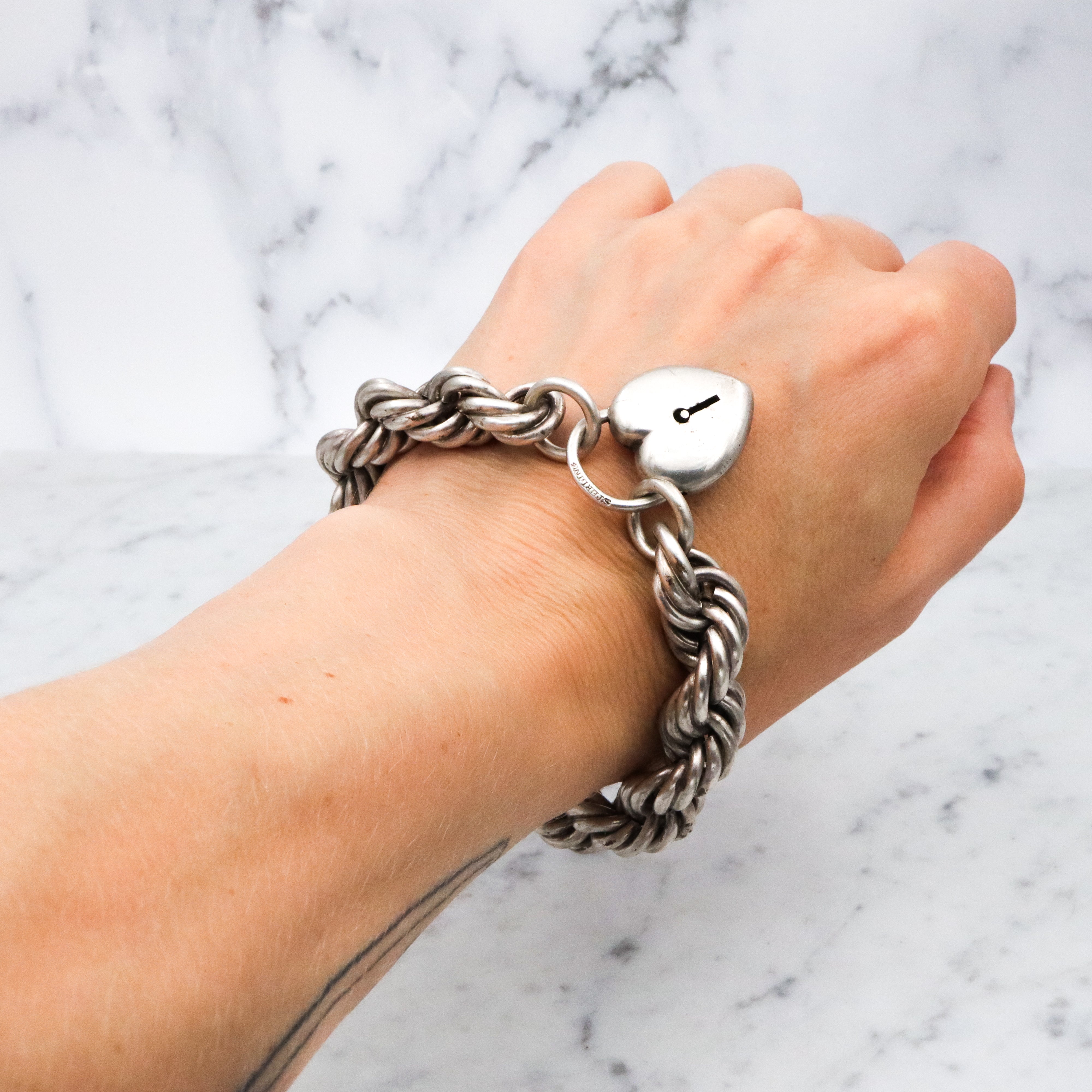 Rare Edwardian sterling Simons Bros thick rope bracelet with heart padlock