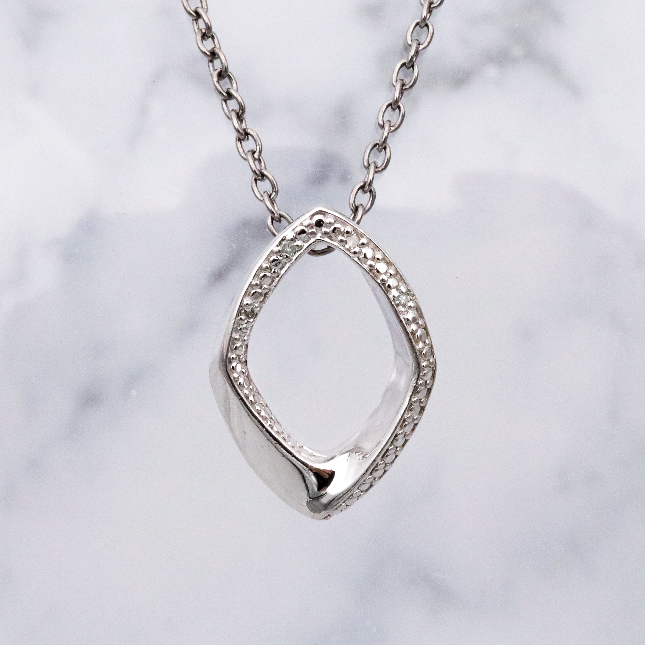 Modern Vintage sterling elongated navette pendant with diamond accents