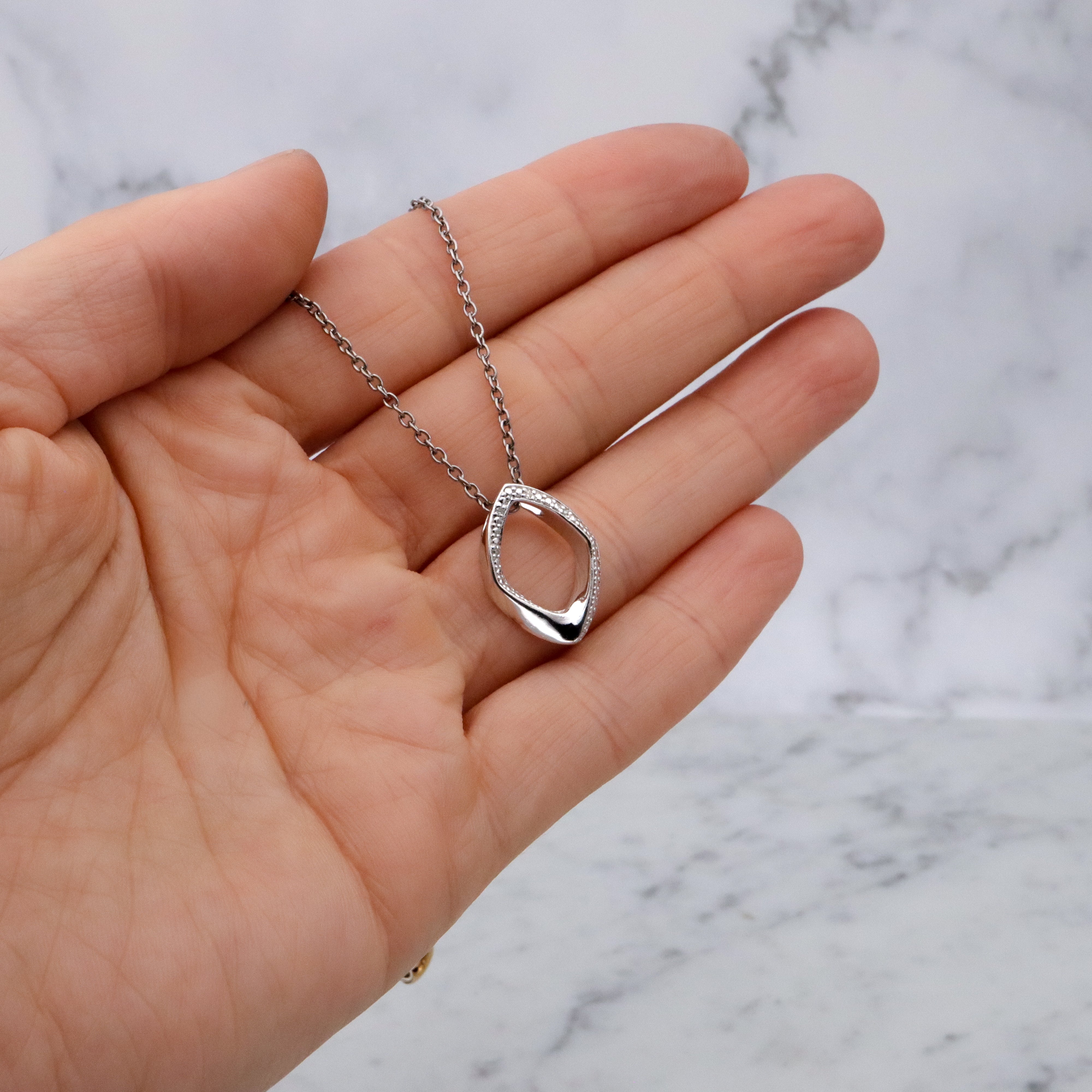 Modern Vintage sterling elongated navette pendant with diamond accents