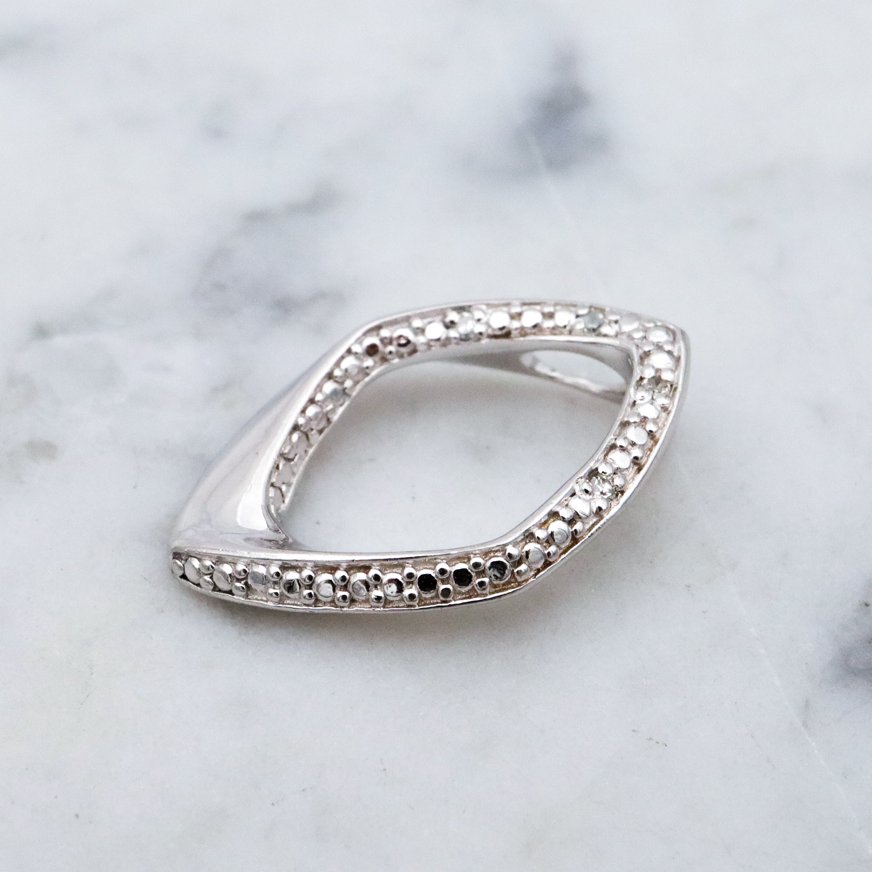 Modern Vintage sterling elongated navette pendant with diamond accents