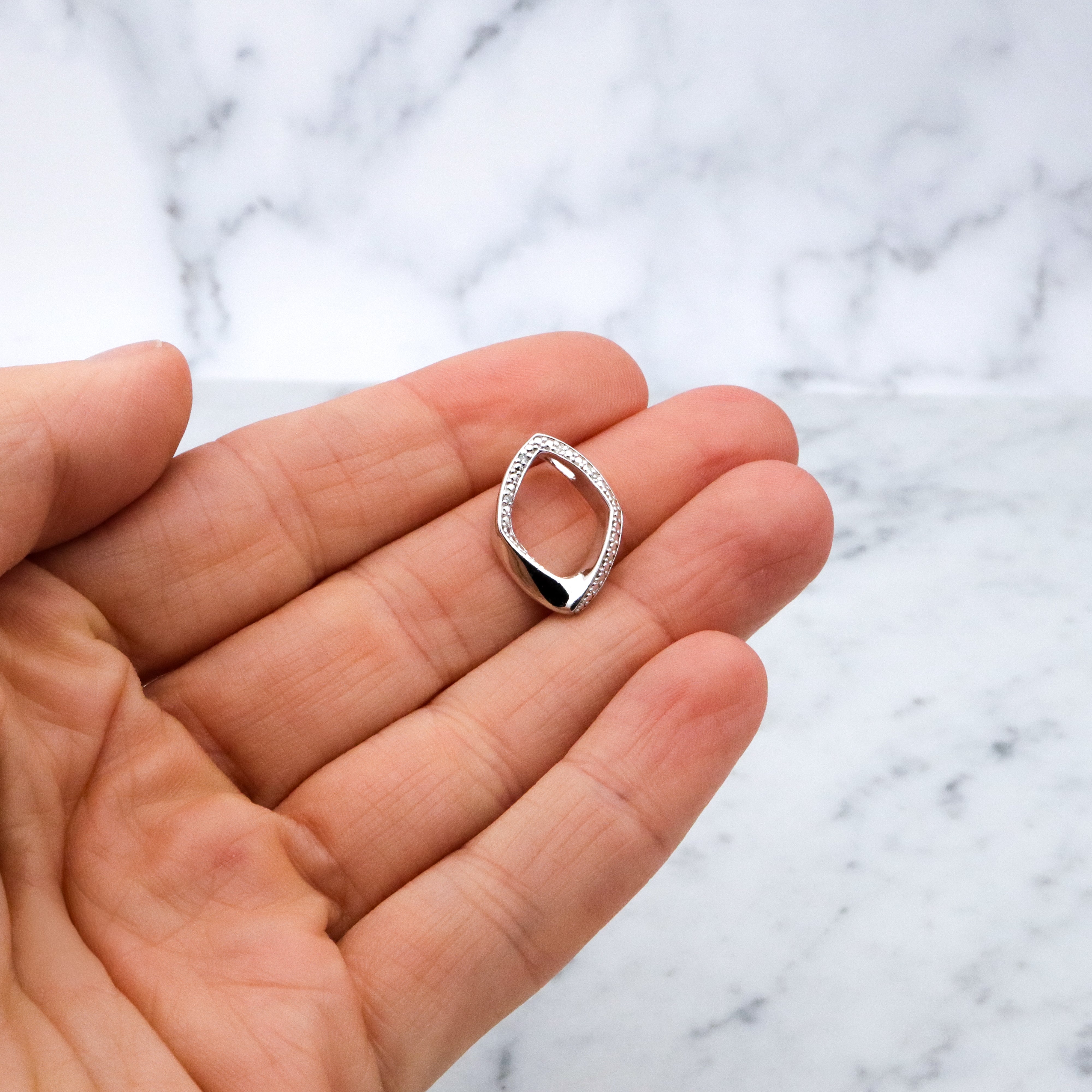 Modern Vintage sterling elongated navette pendant with diamond accents